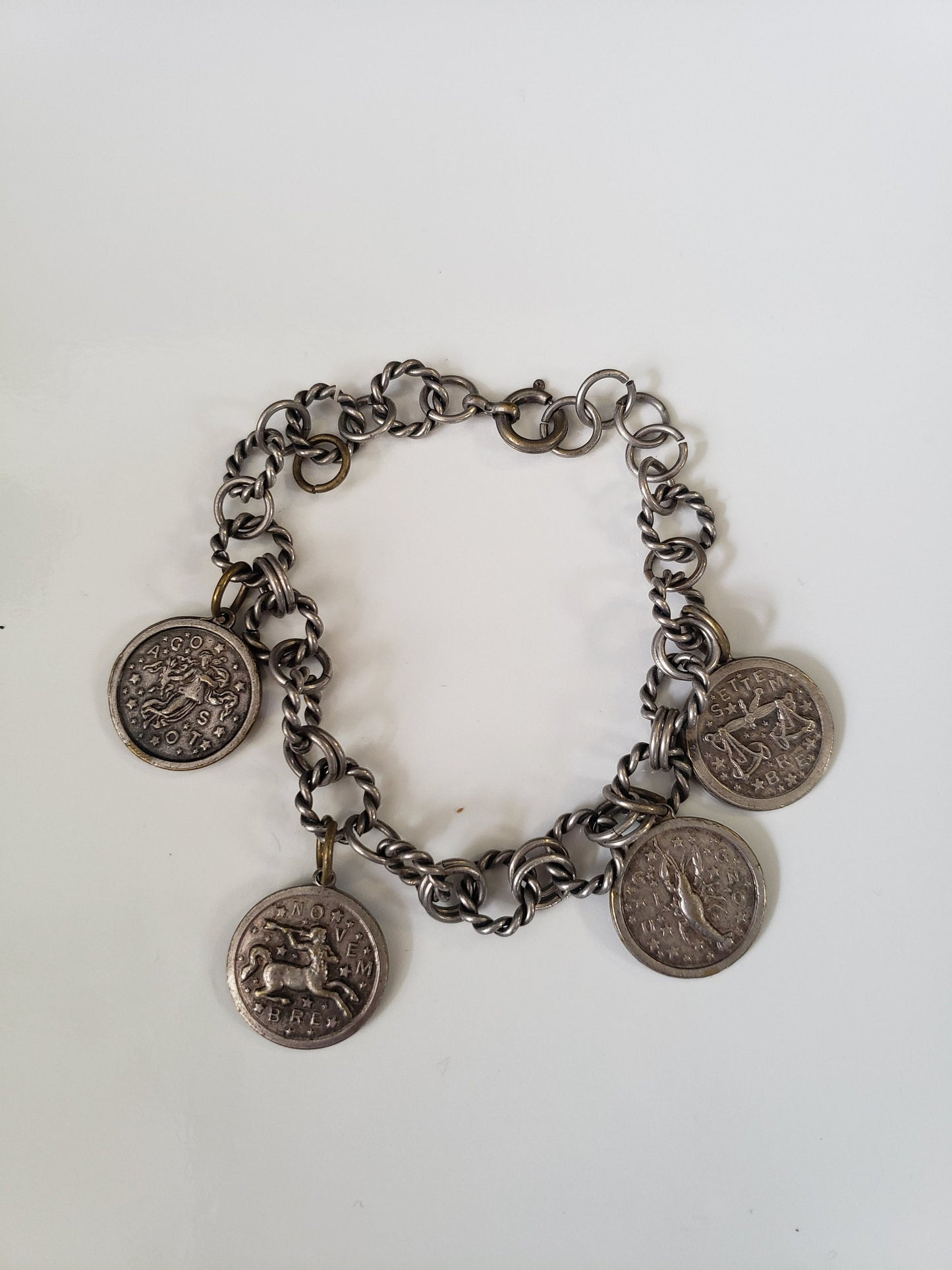 Assorted Lot of Small Medals, Brooches, and Charms