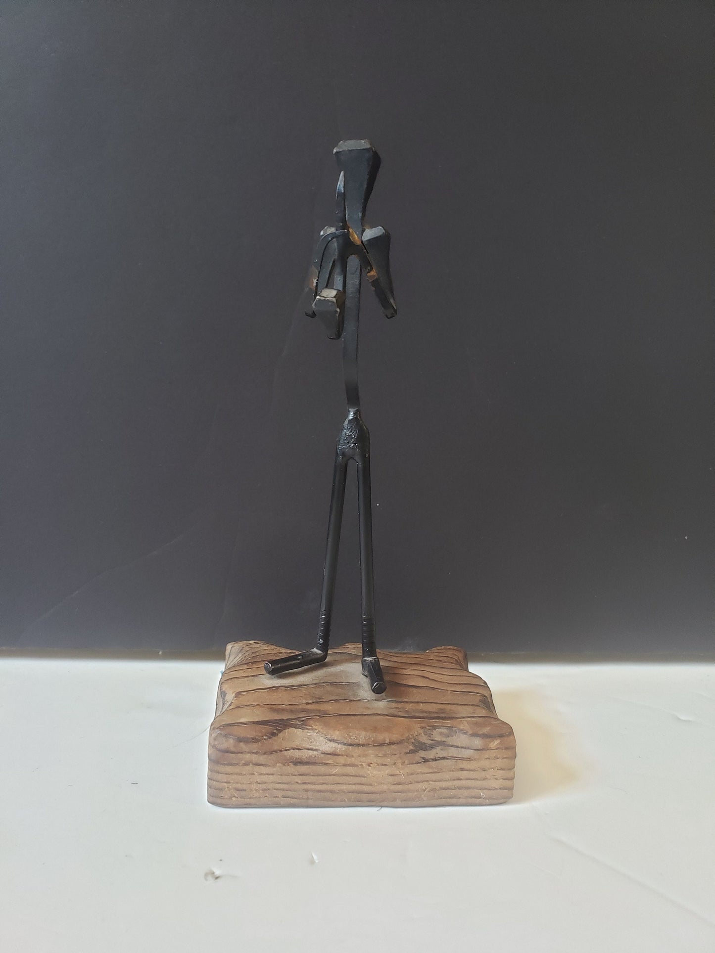 Cast Metal Saxophone Player on Wood Stand