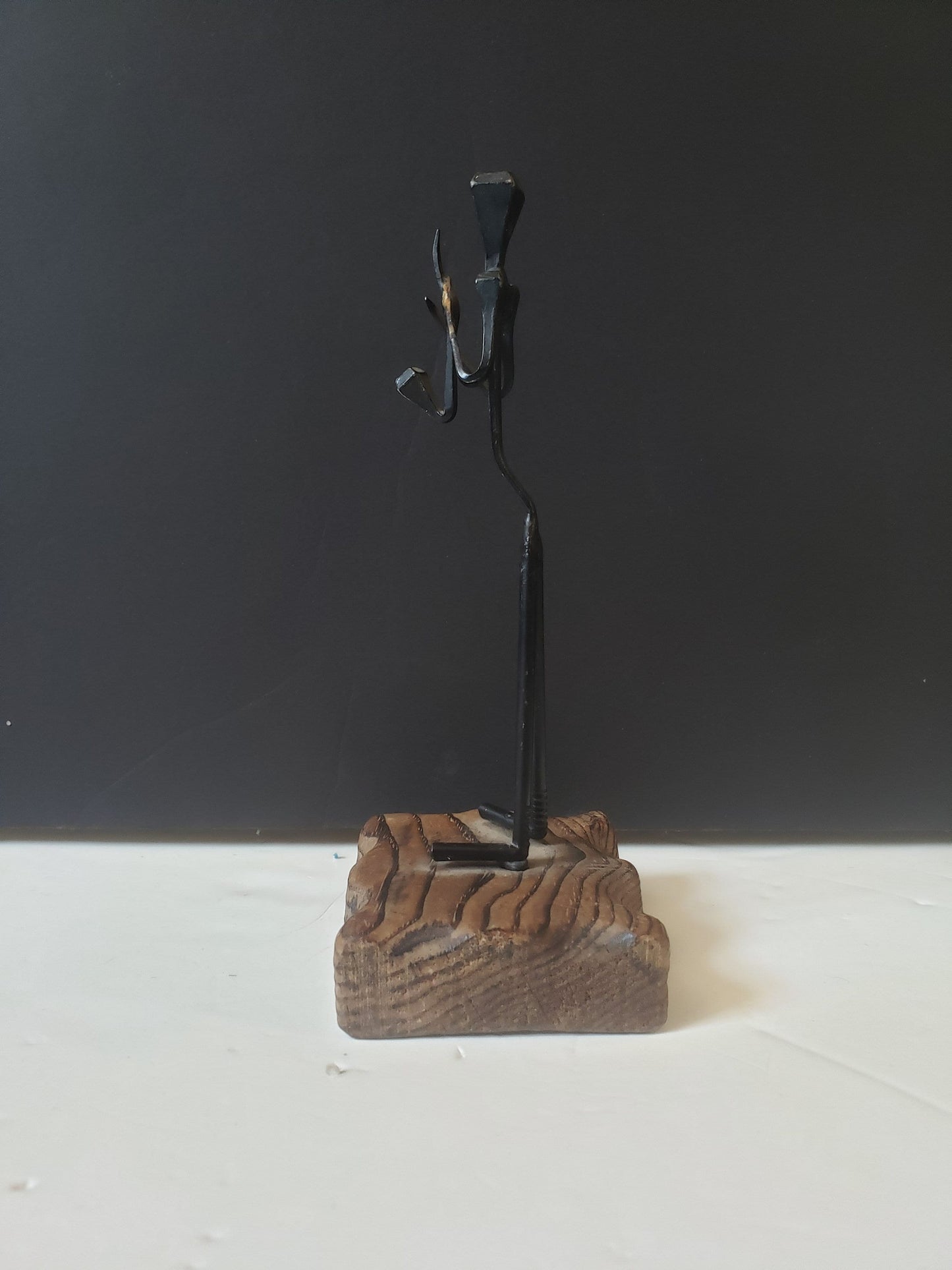 Cast Metal Saxophone Player on Wood Stand