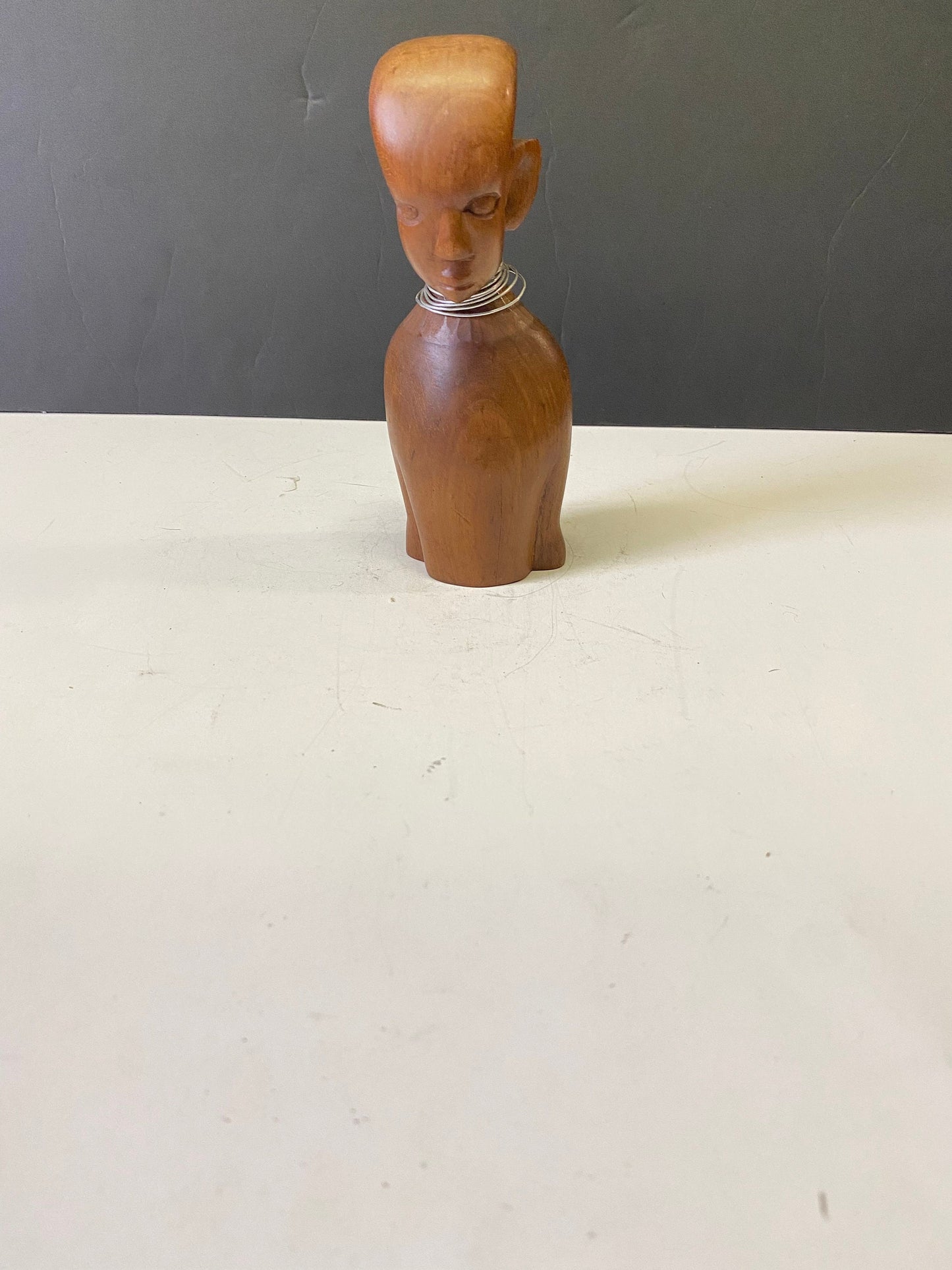 Western African 7 inch wooden female bust with metal necklace