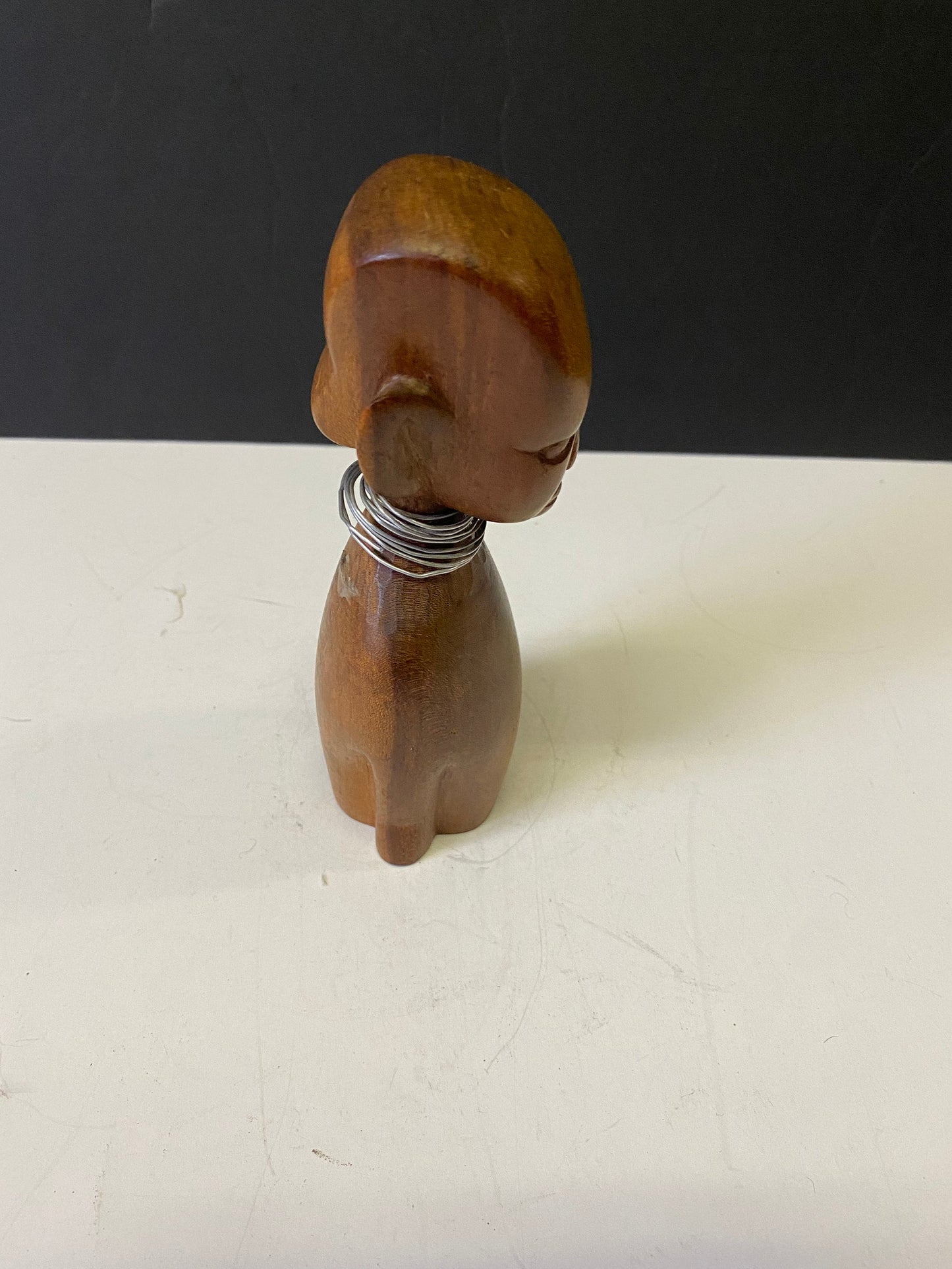 Western African 7 inch wooden female bust with metal necklace