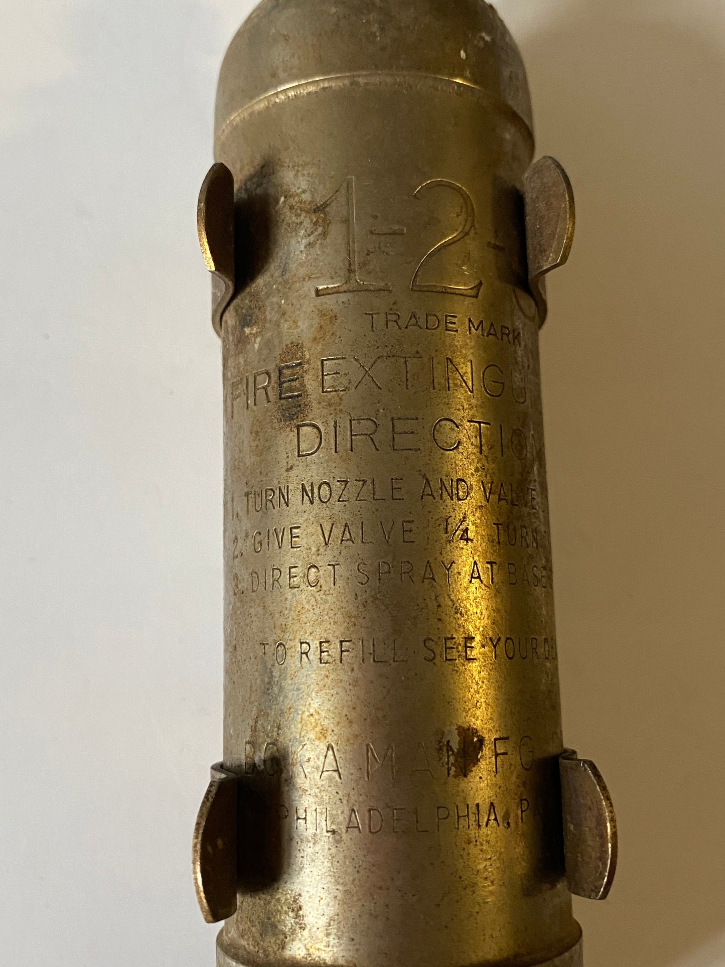 A 8 inch salesman sample fire Extinguisher with bracket very old very cool Philadelphia