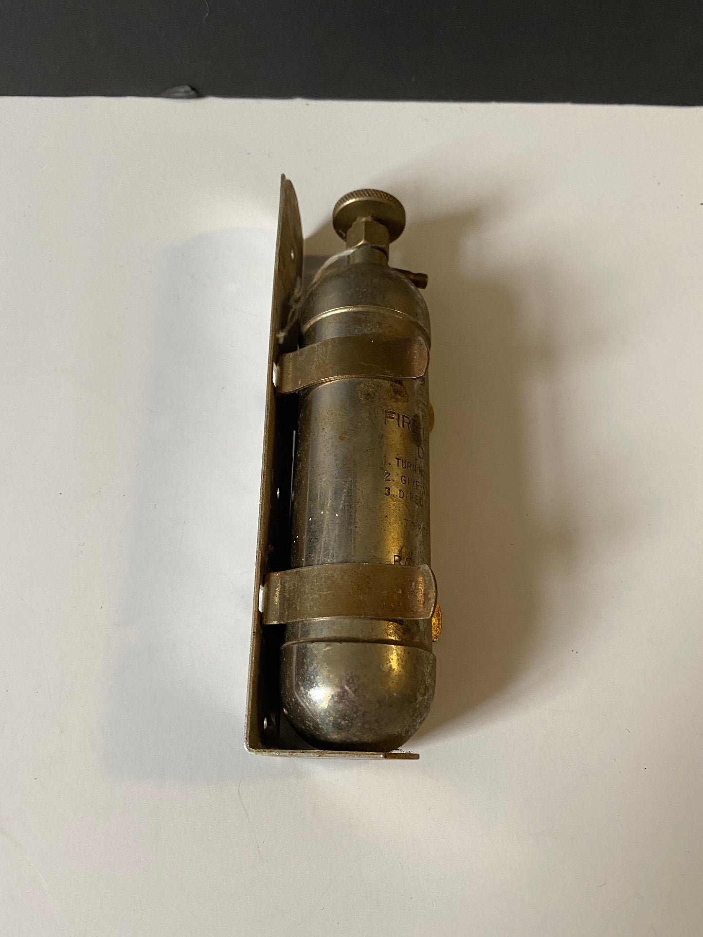 A 8 inch salesman sample fire Extinguisher with bracket very old very cool Philadelphia