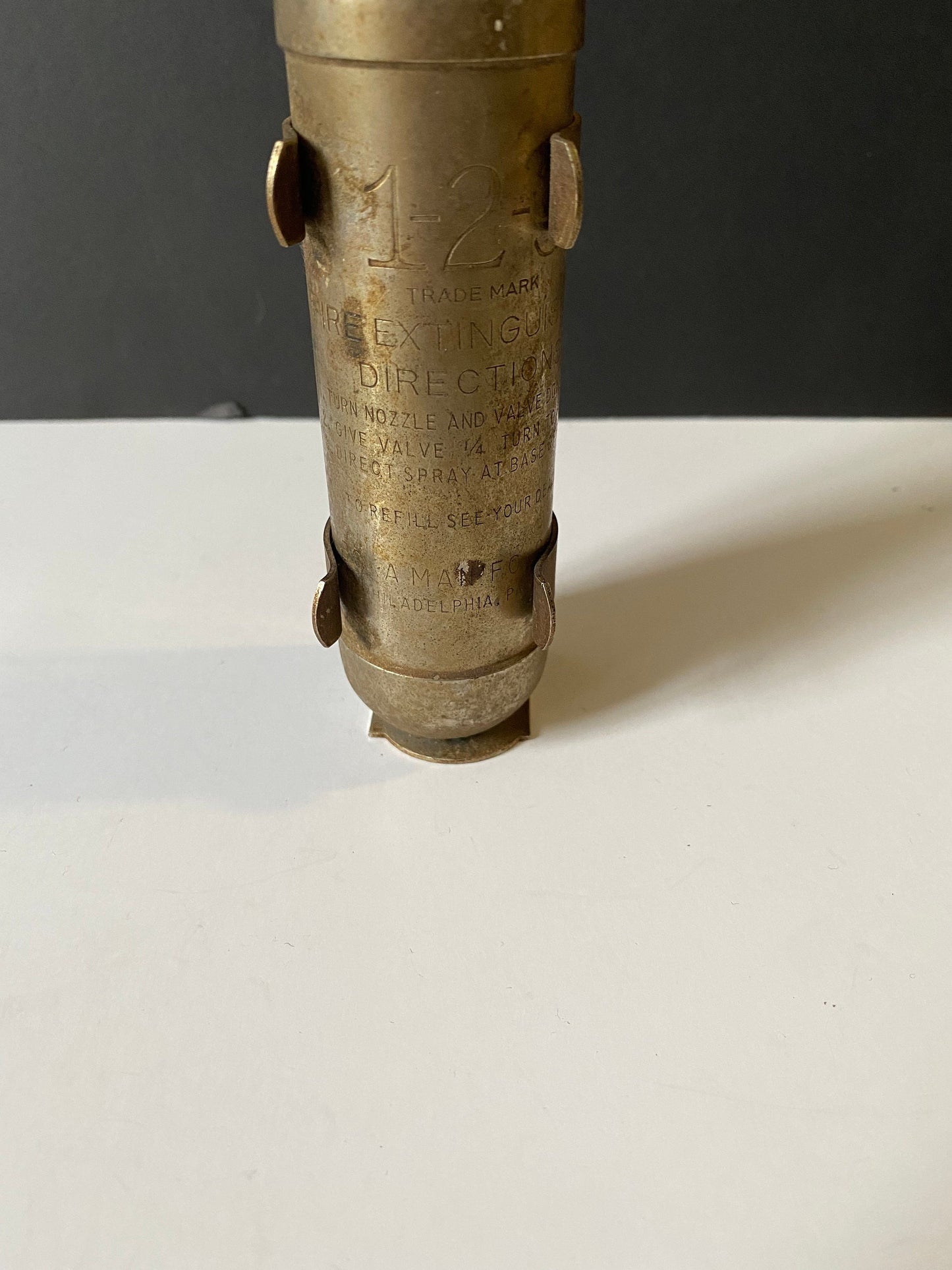 A 8 inch salesman sample fire Extinguisher with bracket very old very cool Philadelphia