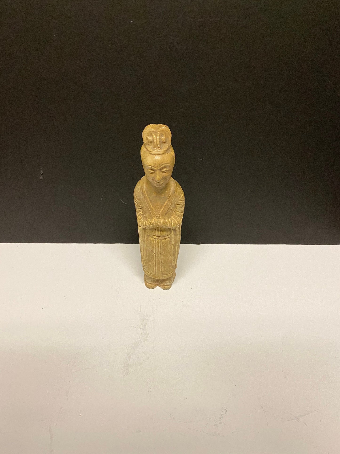A Museum quality 11 inch Chinese pottery statue depicting serene praying man Evaluated as sui dynasty small crack in neck