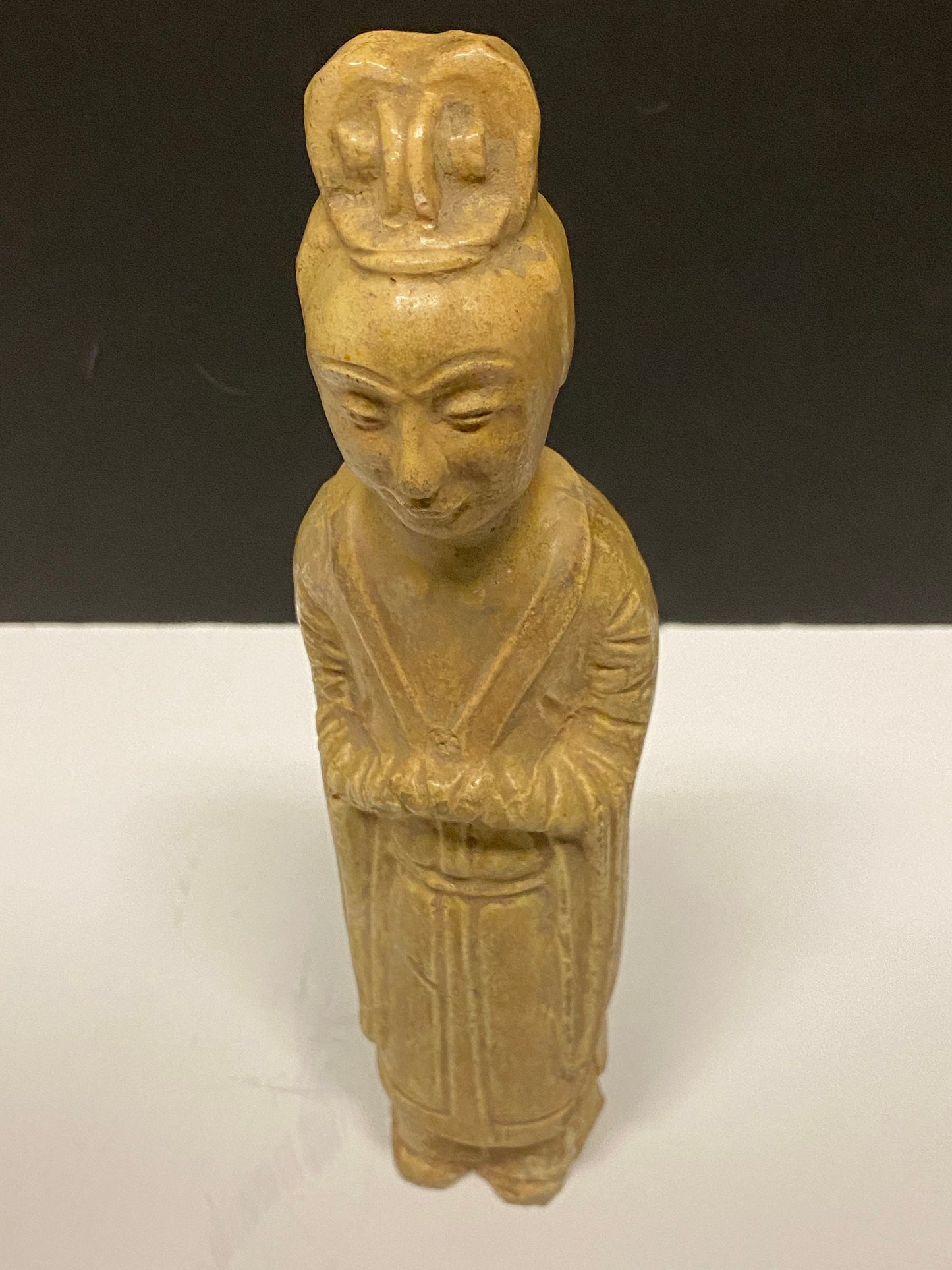 A Museum quality 11 inch Chinese pottery statue depicting serene praying man Evaluated as sui dynasty small crack in neck