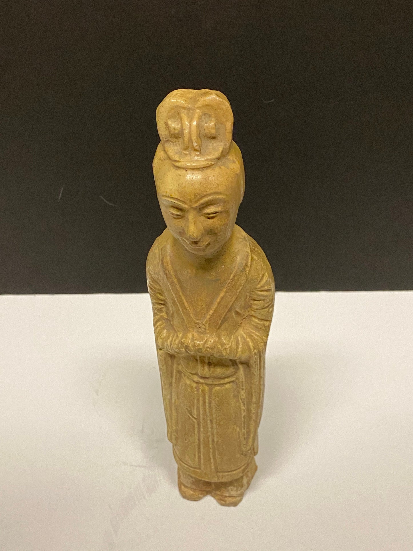 A Museum quality 11 inch Chinese pottery statue depicting serene praying man Evaluated as sui dynasty small crack in neck