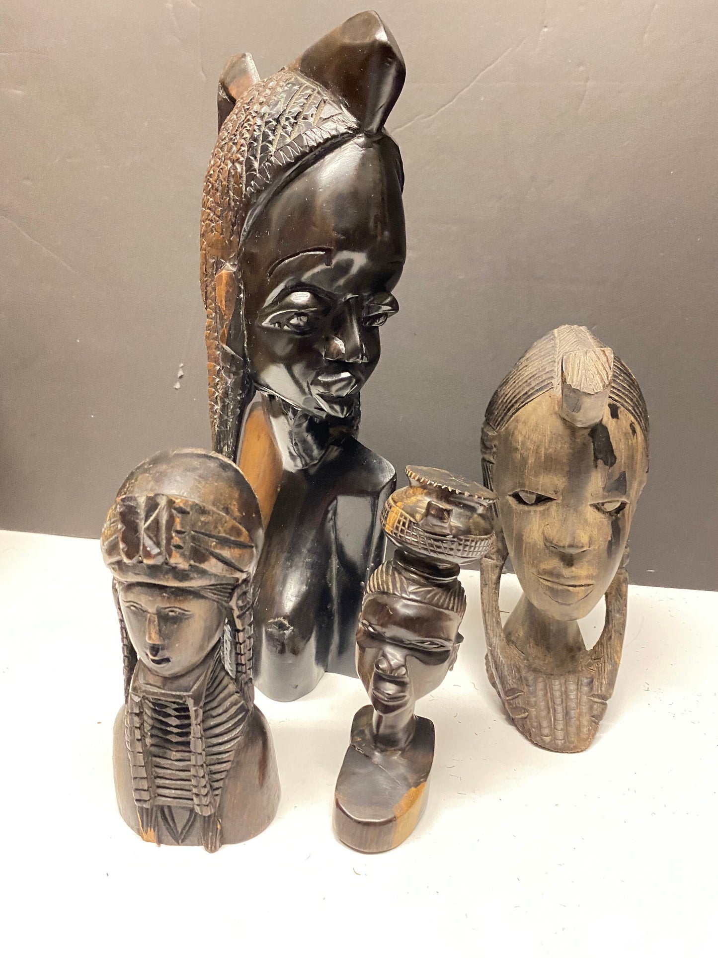 A Collection of four wonderful hardwood ebony African female busts 6 to 13 inches 1500g of carved wood wow wow wow