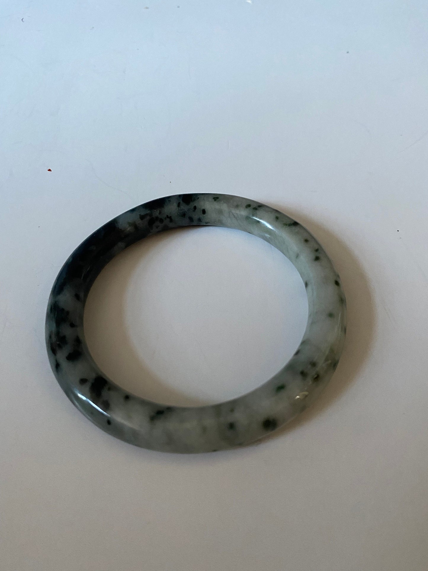 An Absolutely fabulous Chinese rare Jade bangle Mixture of green and black jades 3 inches with 2 inches inside Museum quality wow