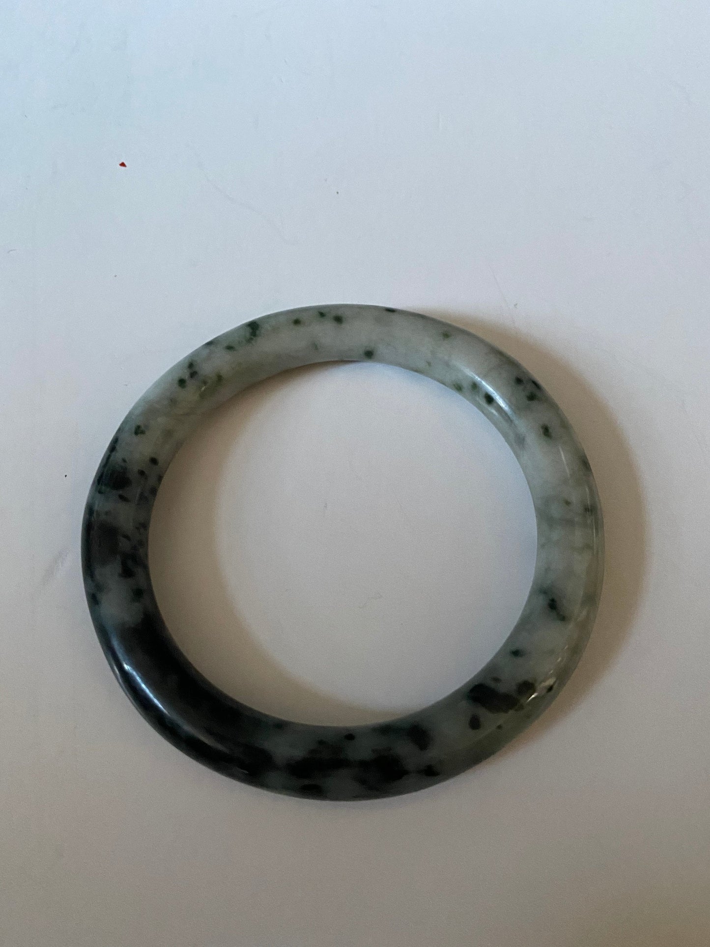 An Absolutely fabulous Chinese rare Jade bangle Mixture of green and black jades 3 inches with 2 inches inside Museum quality wow
