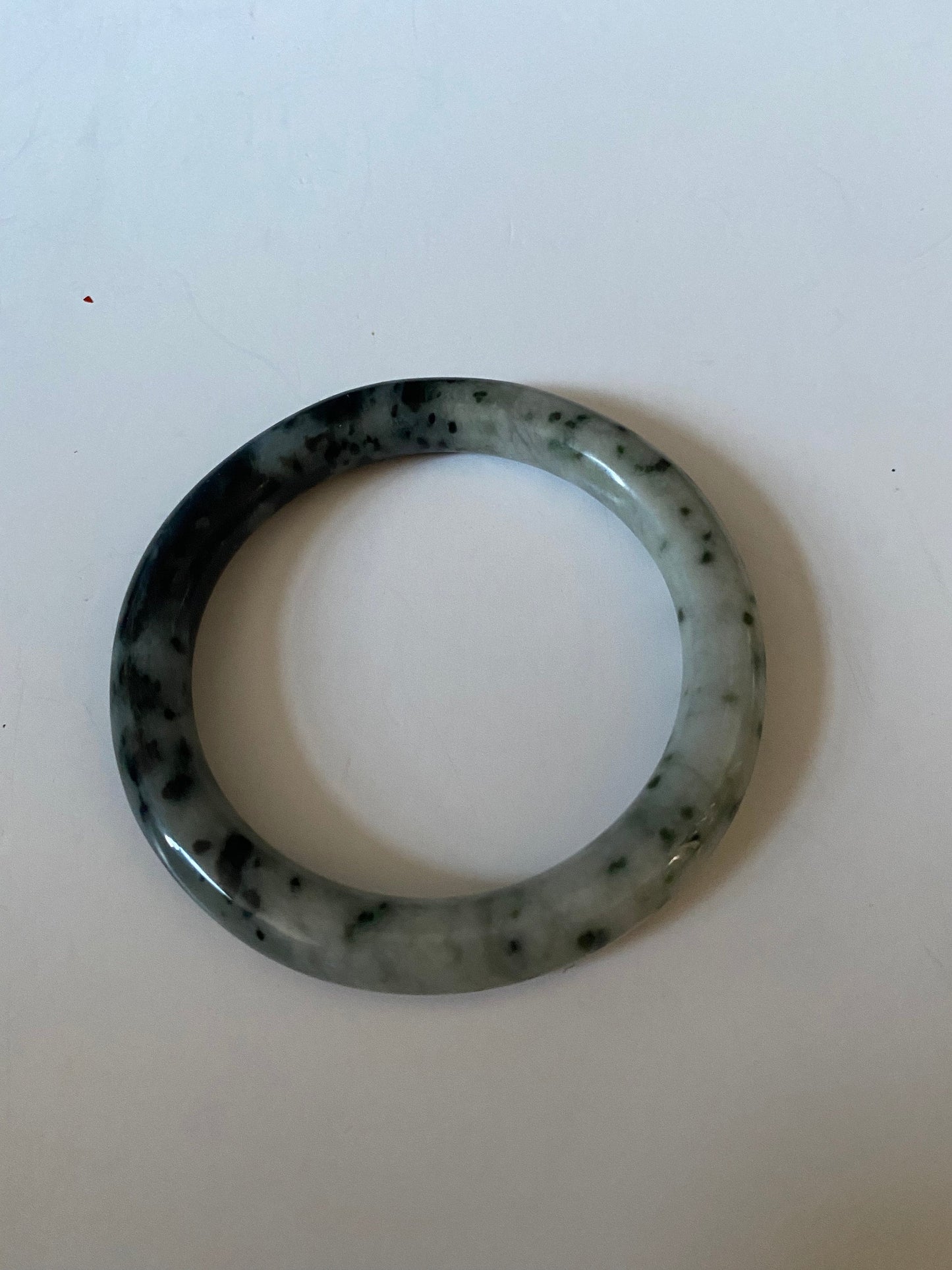 An Absolutely fabulous Chinese rare Jade bangle Mixture of green and black jades 3 inches with 2 inches inside Museum quality wow