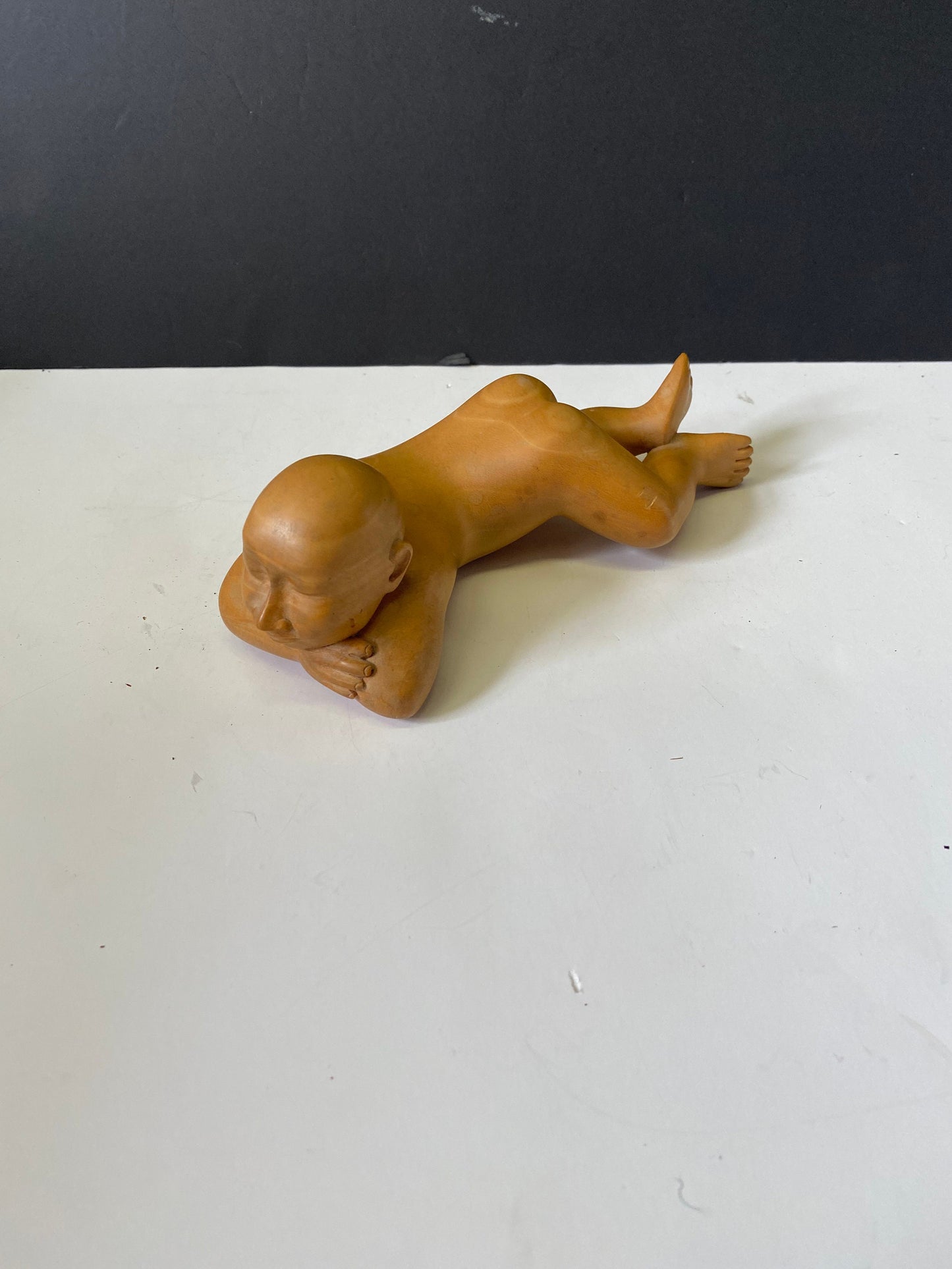 A Fabulous older Indonesian Carved statue of a man reclining Top notch Carving and detail Unbelievable piece