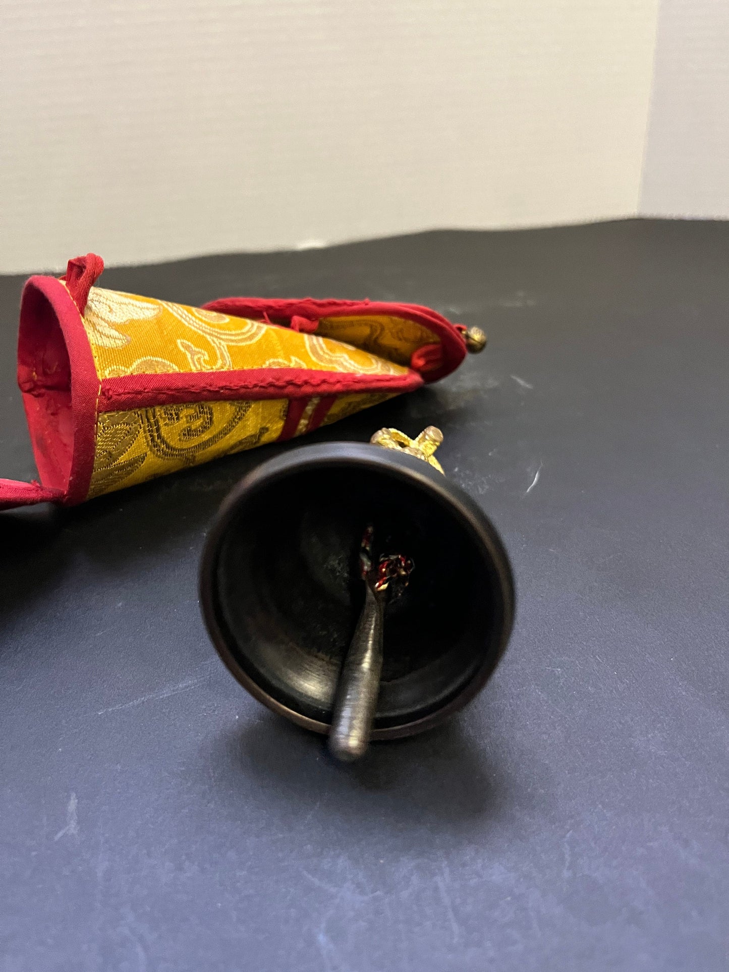 Stunning 5 inch southeast Asian bronze and gilded bell on great condition with original silk carrying case nice sound, and a great gift