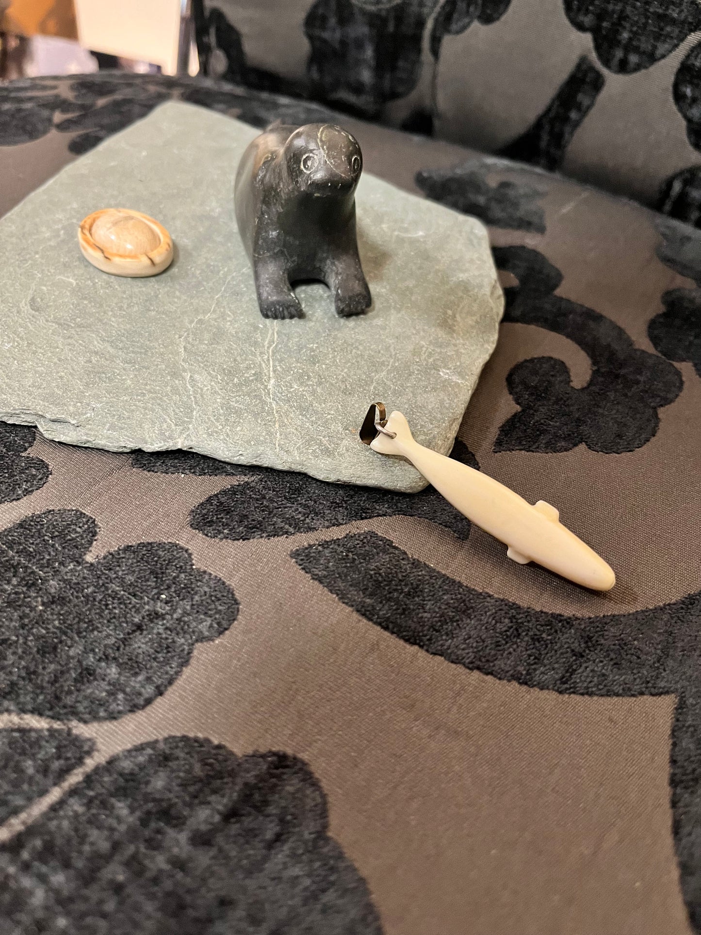 Lovely 9 x 6 vintage Inuit soapstone and bone seal fishing on a stone stand  lovely