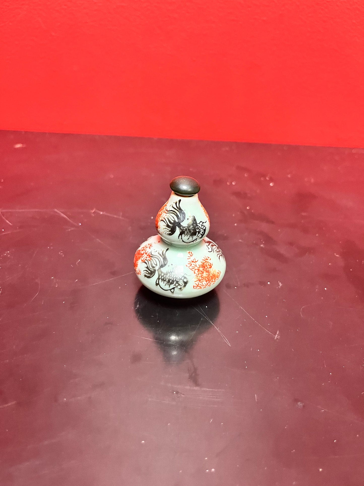 An Antique Chinese 3 inch high double barrelled porcelain snuff bottle with koi fish and flowers - great value