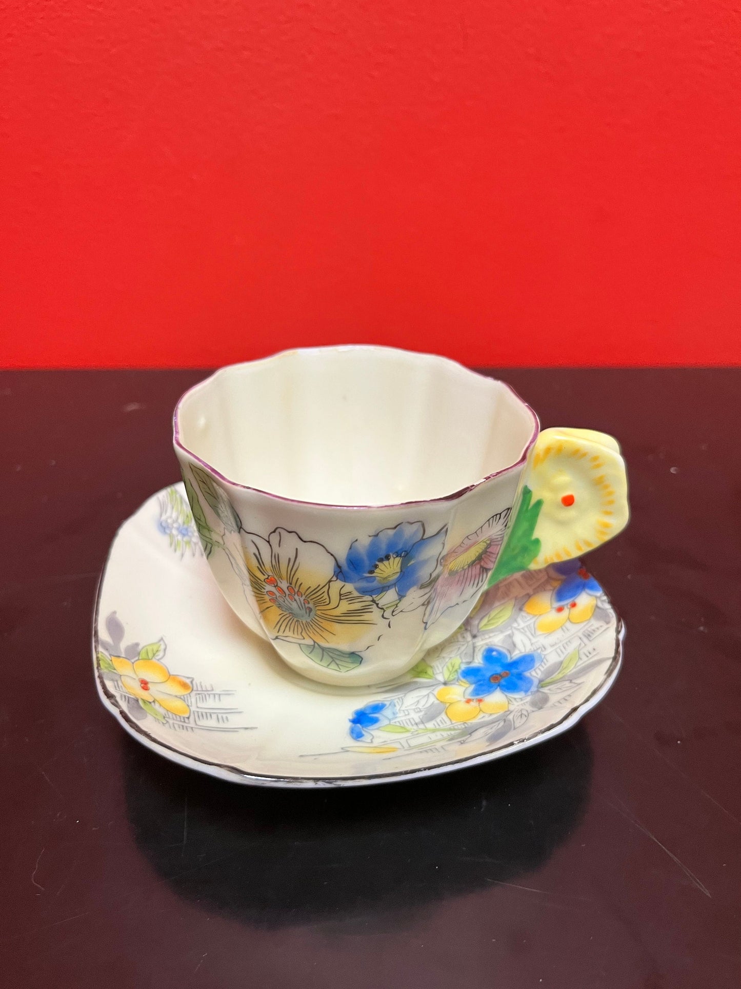 A  Rare unusual English cup and saucer with flower handle  lovely condition and a great price