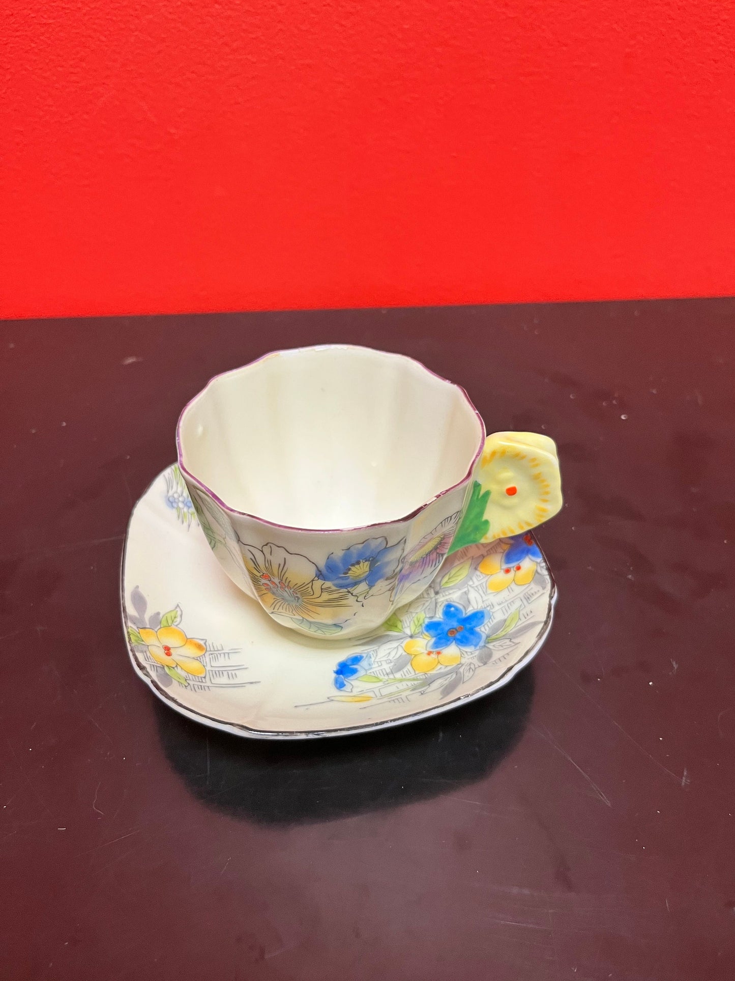 A  Rare unusual English cup and saucer with flower handle  lovely condition and a great price