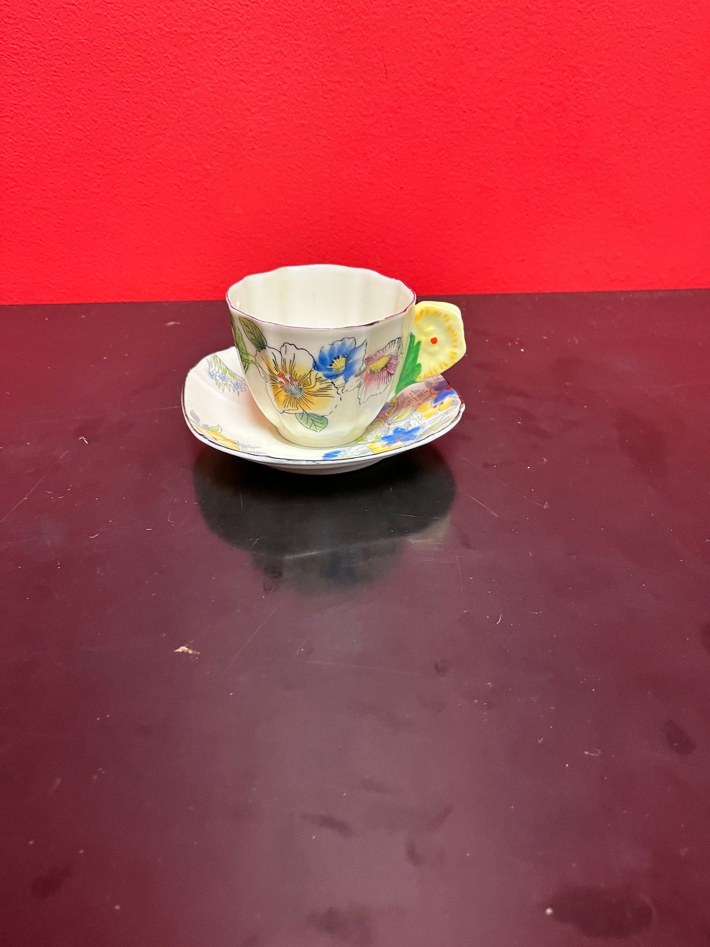 A  Rare unusual English cup and saucer with flower handle  lovely condition and a great price