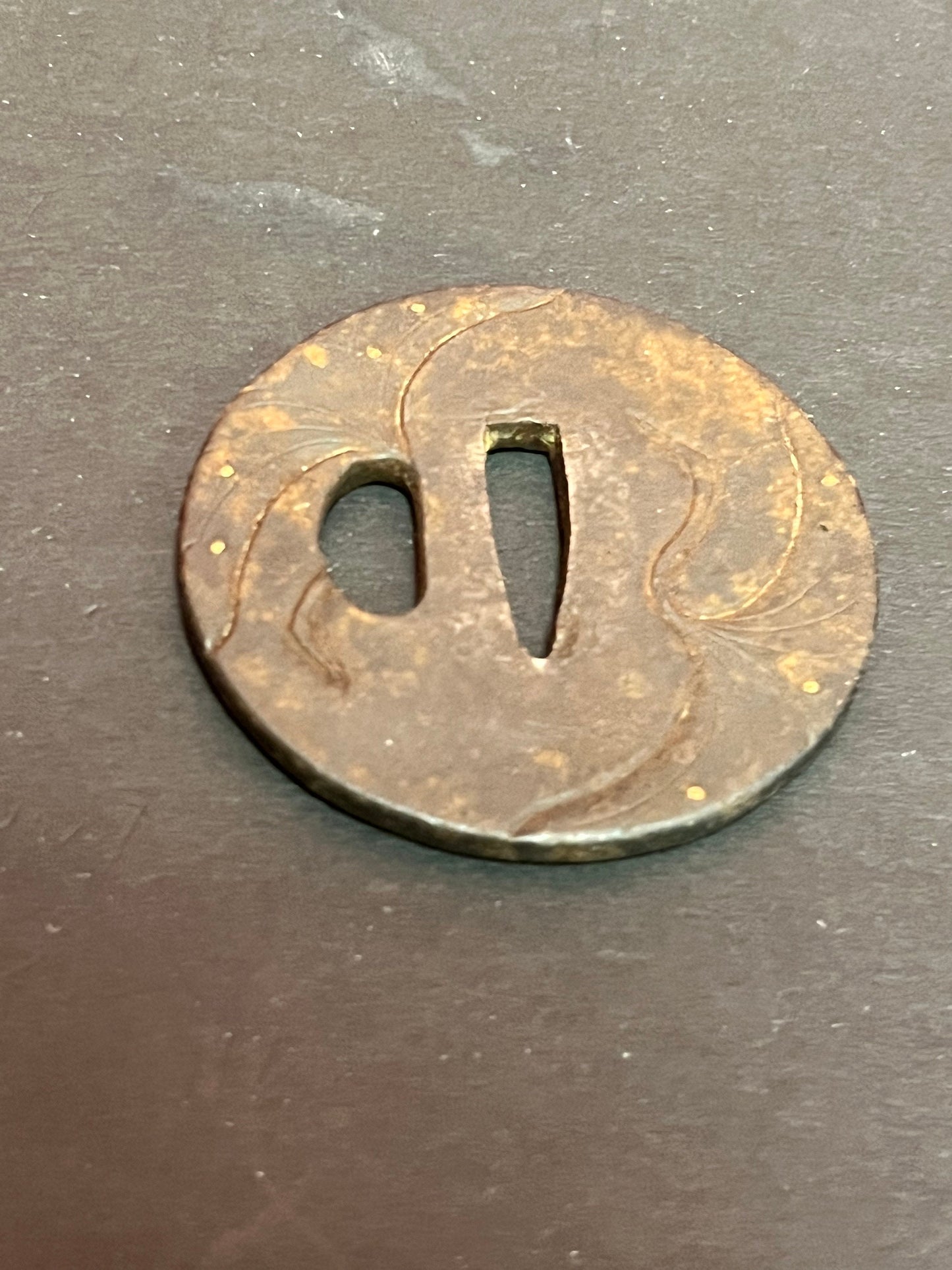 A Japanese ancient bronze samurai sword tsuba really old and detailed 3 inches some rust patina