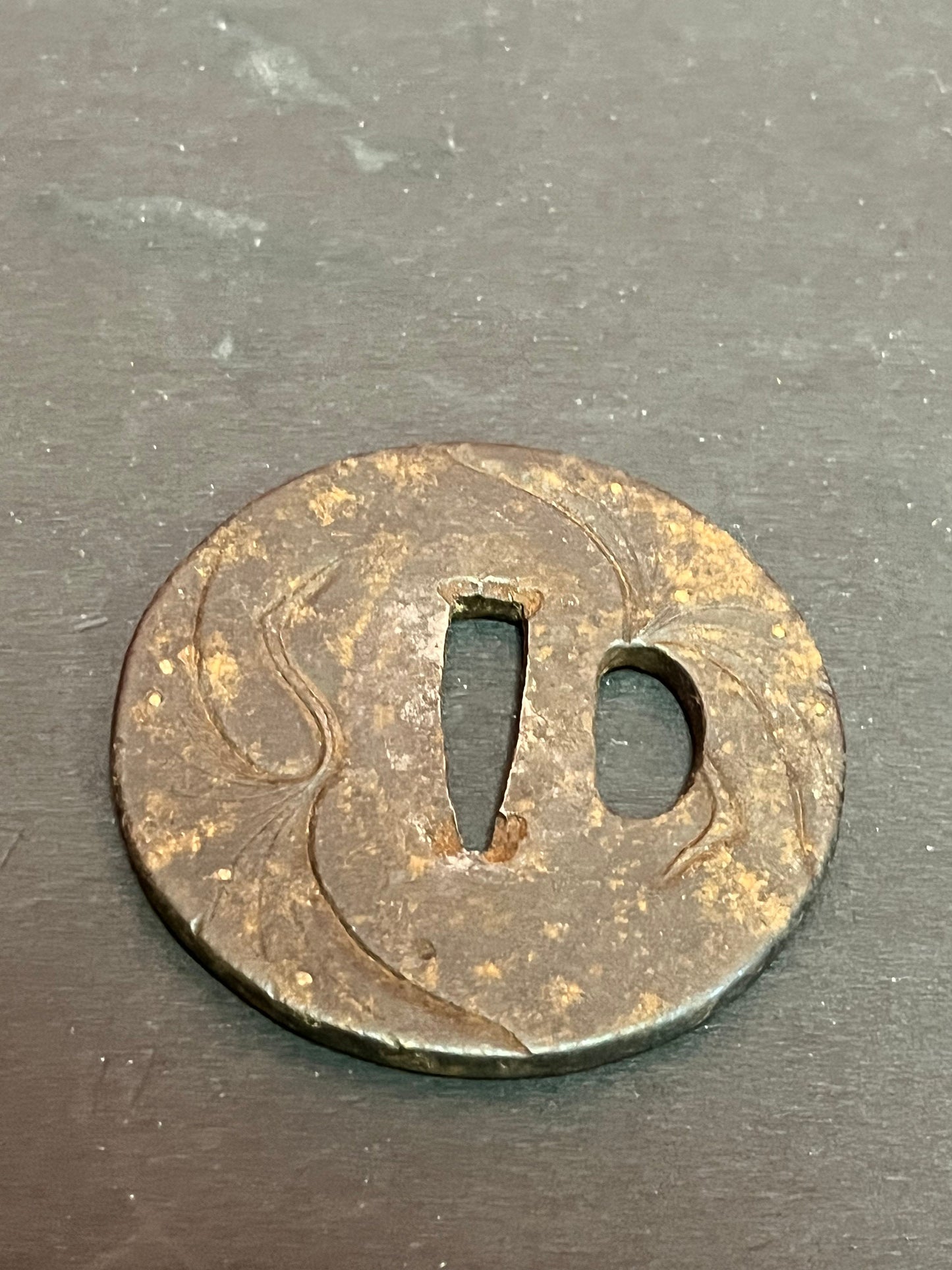 A Japanese ancient bronze samurai sword tsuba really old and detailed 3 inches some rust patina