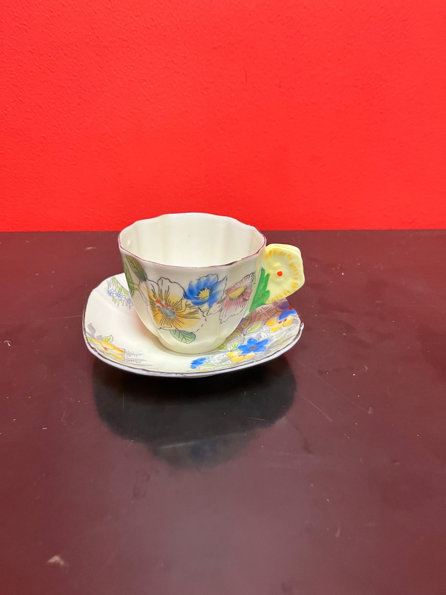 A  Rare unusual English cup and saucer with flower handle  lovely condition and a great price