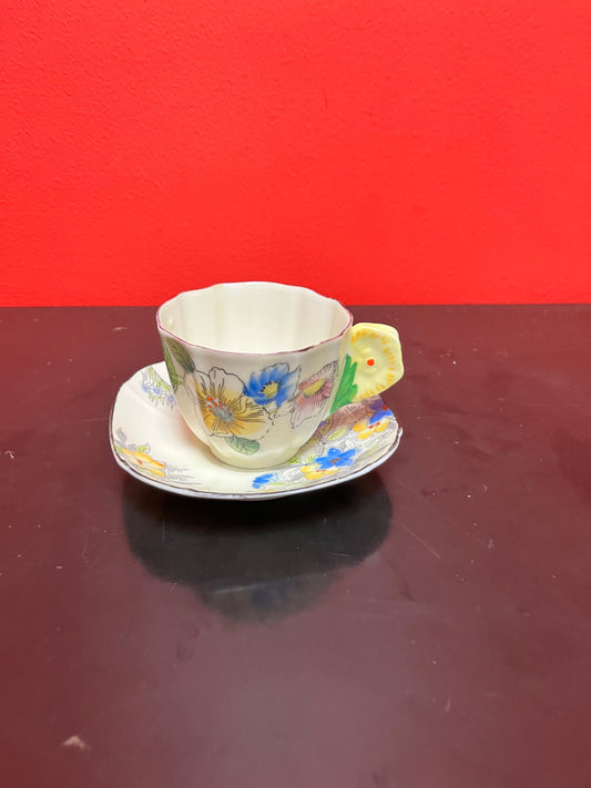 A  Rare unusual English cup and saucer with flower handle  lovely condition and a great price