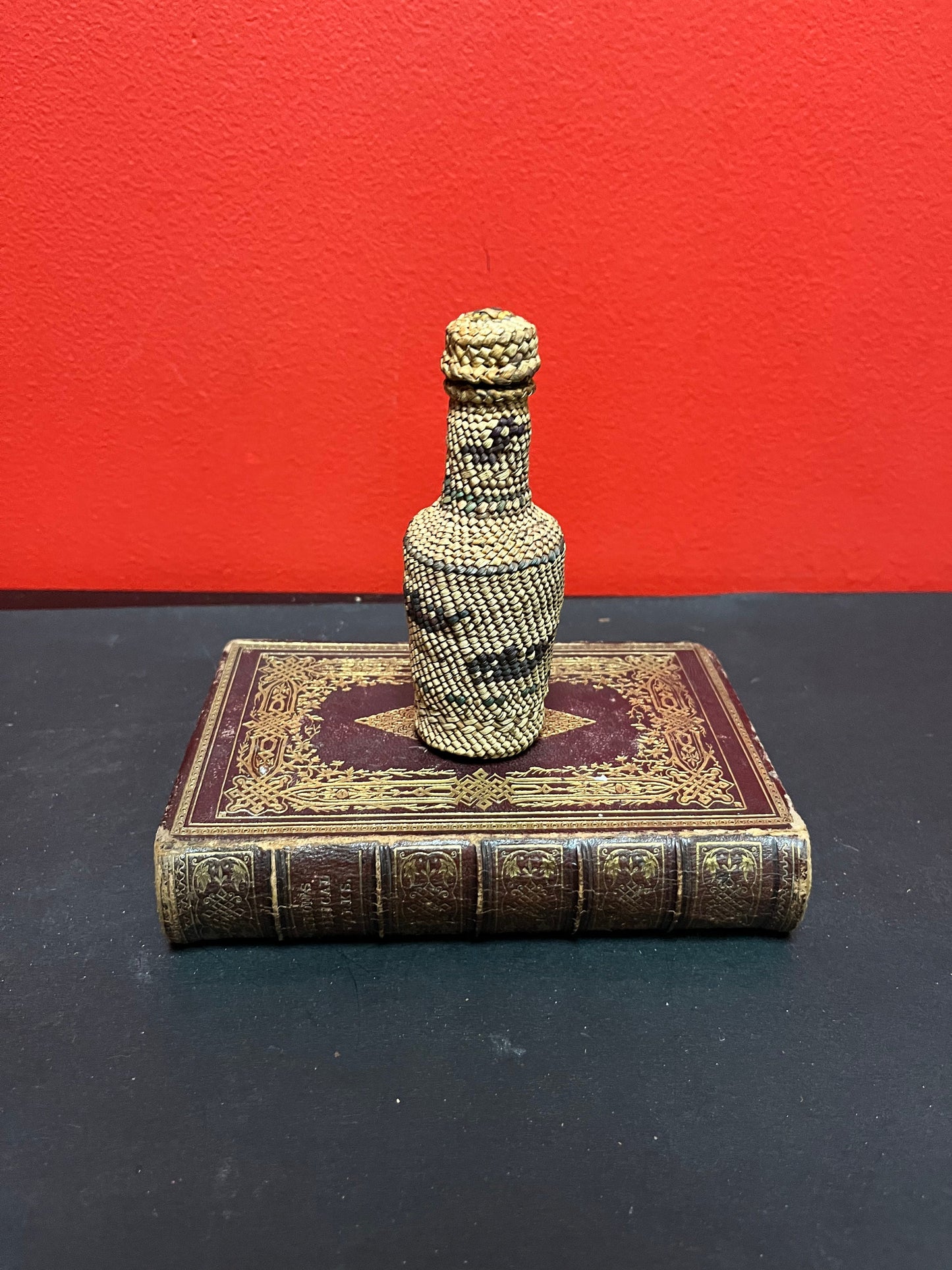 Lovely 5 inch high indigenous, first nations pacific northwest coast woven covered bottle  with hunting scene  mint condition