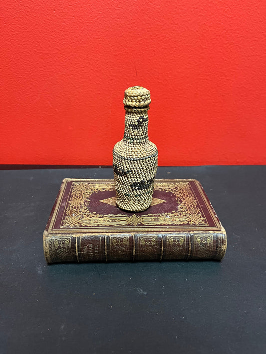 Lovely 5 inch high indigenous, first nations pacific northwest coast woven covered bottle  with hunting scene  mint condition