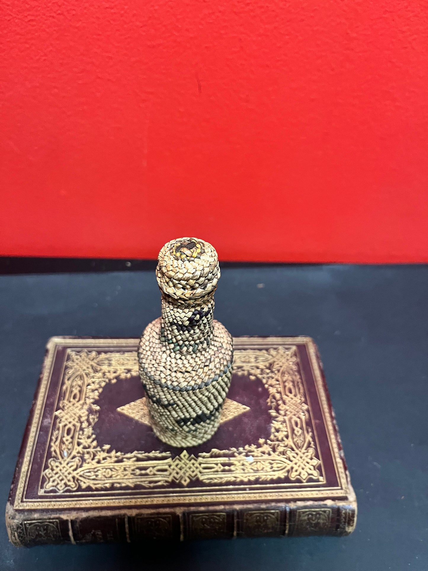 Lovely 5 inch high indigenous, first nations pacific northwest coast woven covered bottle  with hunting scene  mint condition