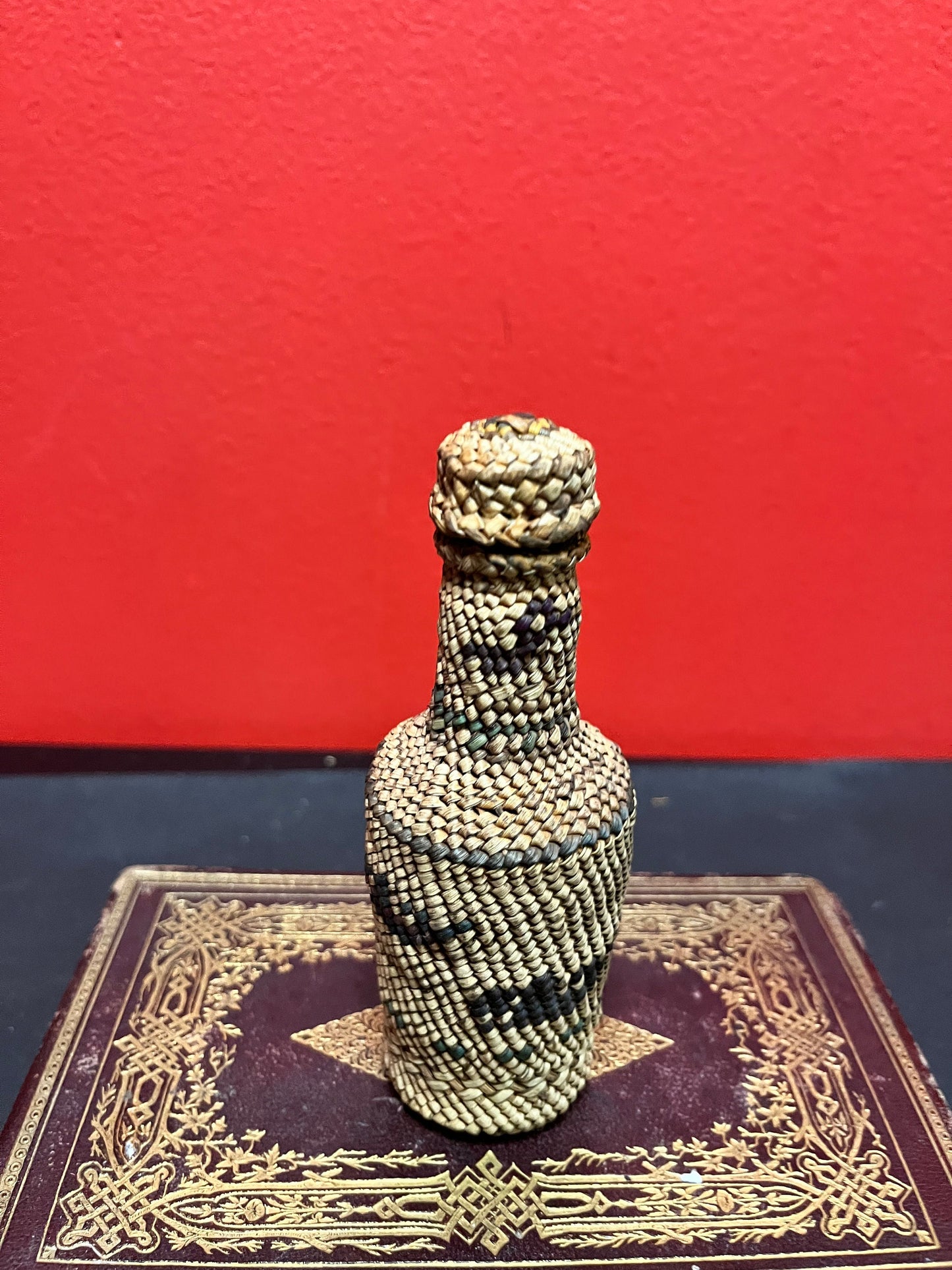 Lovely 5 inch high indigenous, first nations pacific northwest coast woven covered bottle  with hunting scene  mint condition