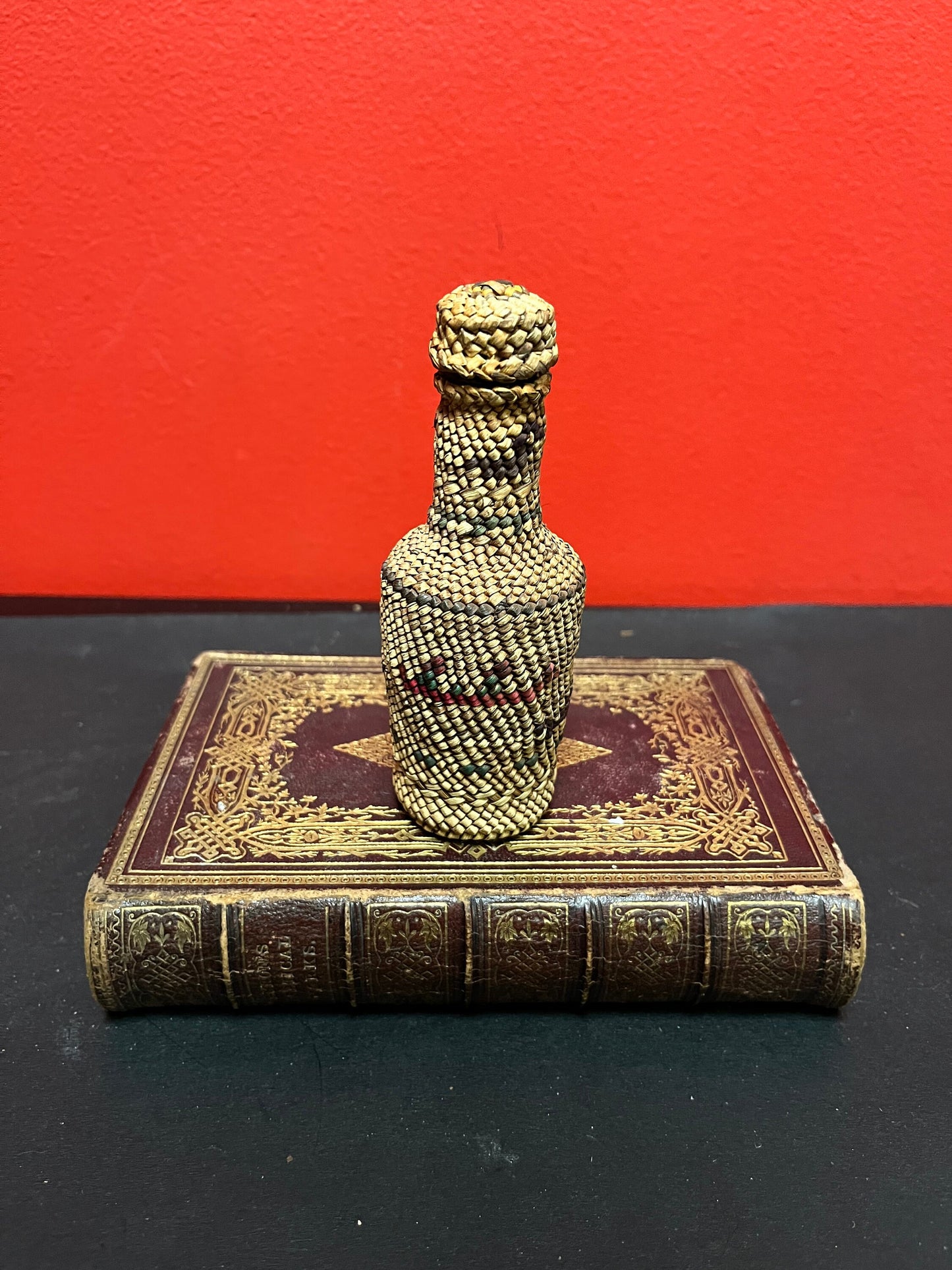 Lovely 5 inch high indigenous, first nations pacific northwest coast woven covered bottle  with hunting scene  mint condition