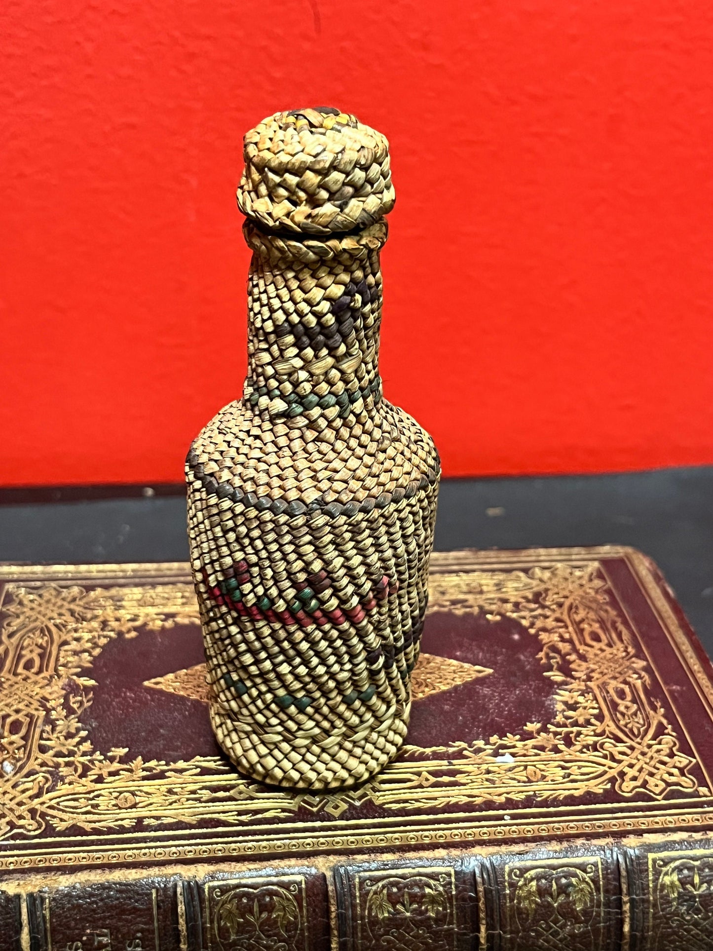 Lovely 5 inch high indigenous, first nations pacific northwest coast woven covered bottle  with hunting scene  mint condition