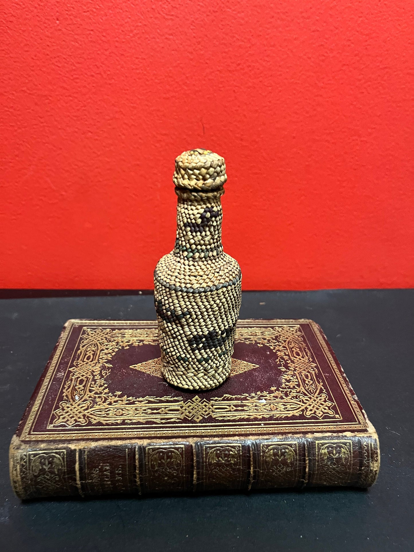 Lovely 5 inch high indigenous, first nations pacific northwest coast woven covered bottle  with hunting scene  mint condition