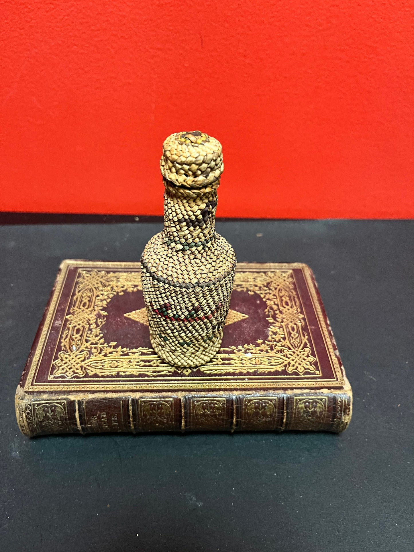 Lovely 5 inch high indigenous, first nations pacific northwest coast woven covered bottle  with hunting scene  mint condition