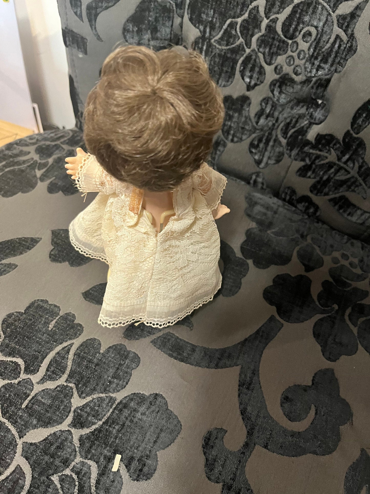 8 1/2 inch Victorian porcelain doll with original clothes on stand