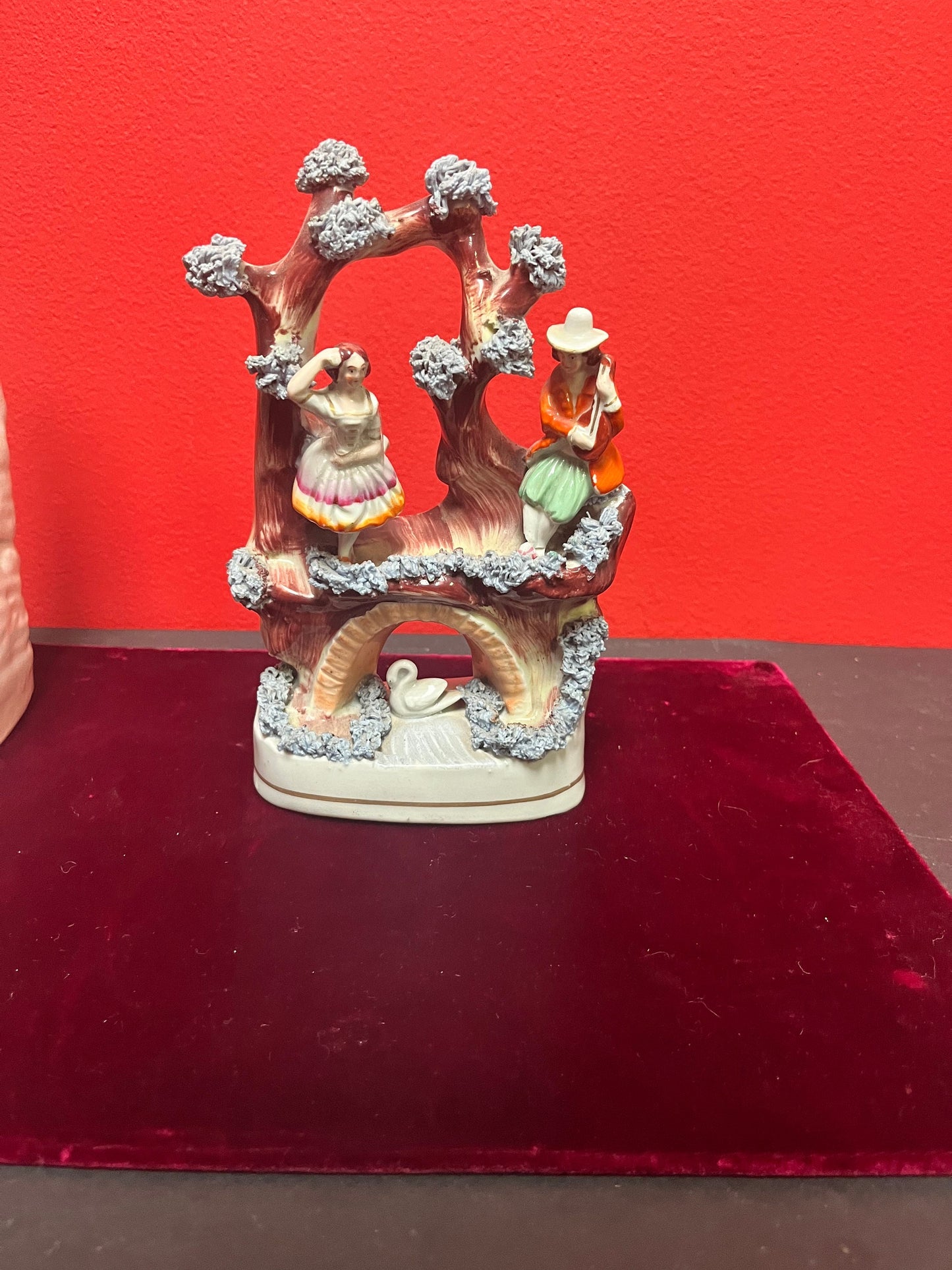 An 8 inch tall antique Staffordshire Swan Lake statue great antique condition see photos