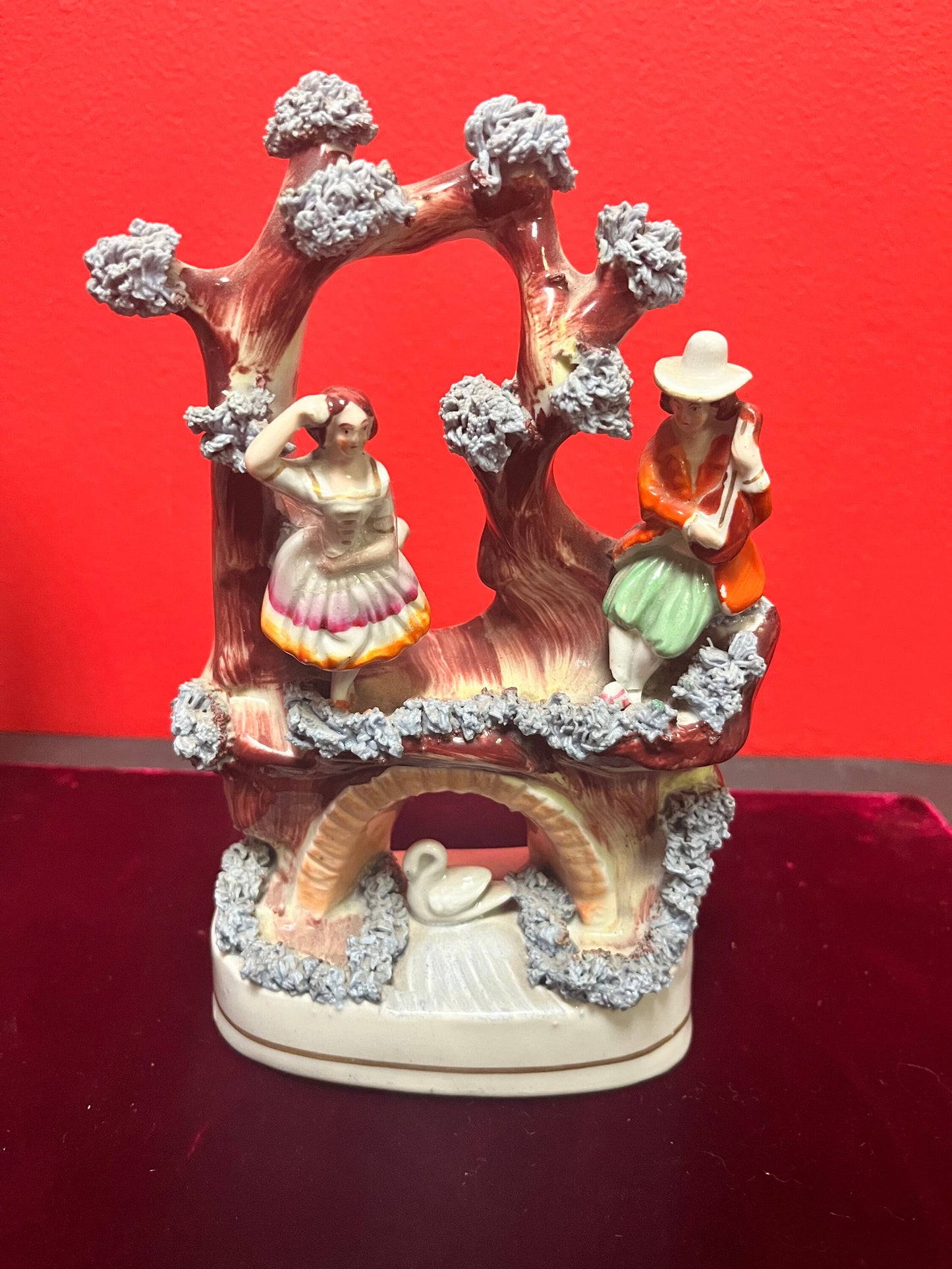 An 8 inch tall antique Staffordshire Swan Lake statue great antique condition see photos