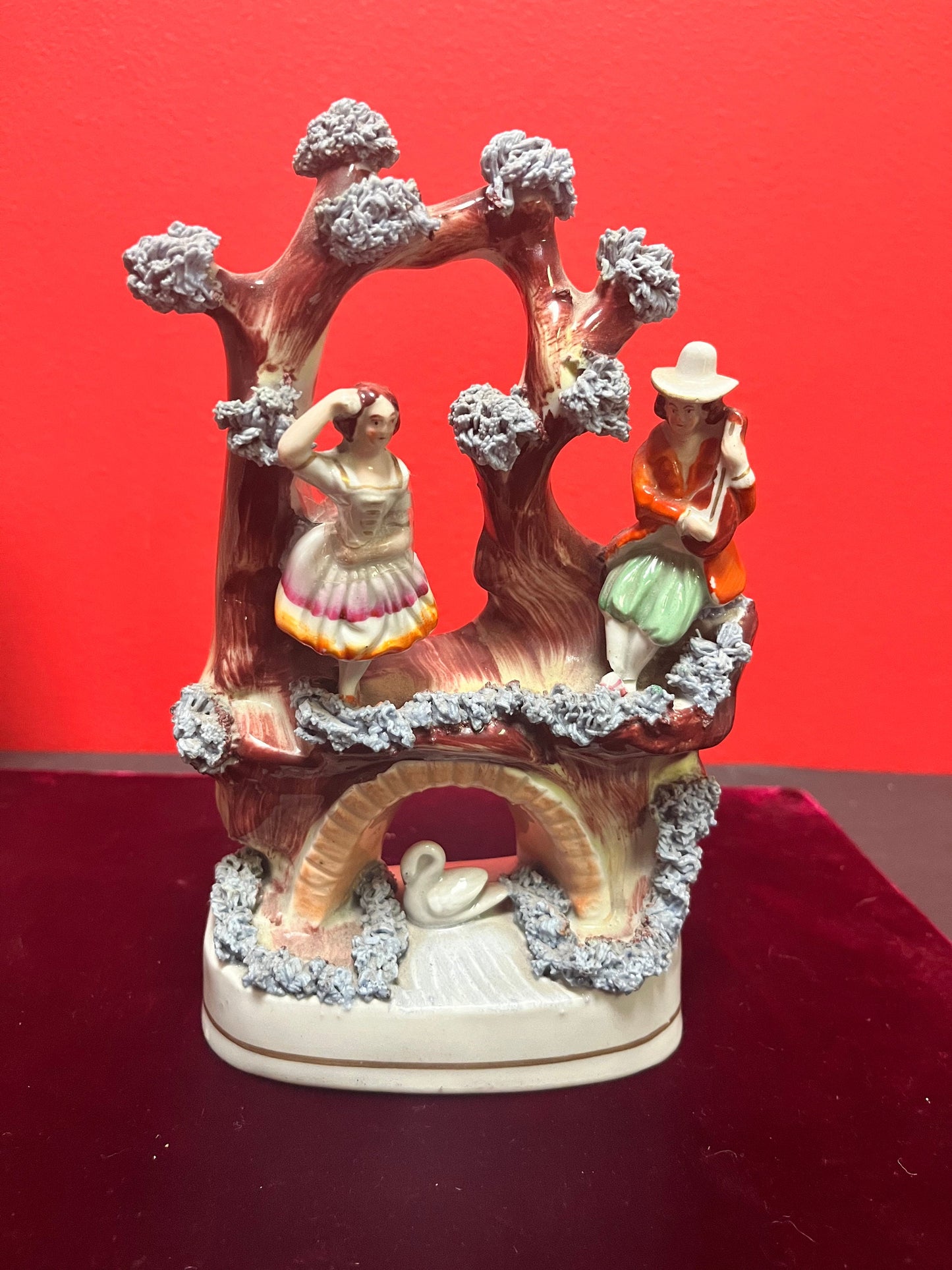 An 8 inch tall antique Staffordshire Swan Lake statue great antique condition see photos