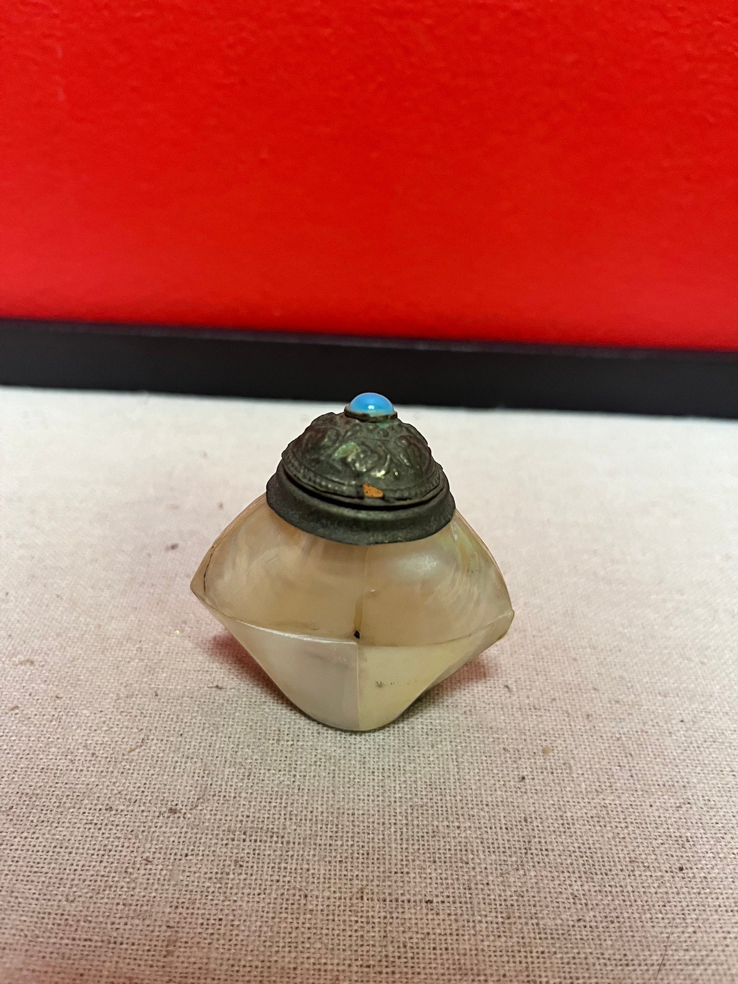 Lovely, 2 inch high shell and bronze bottle  with cartouche  As is  priced accordingly