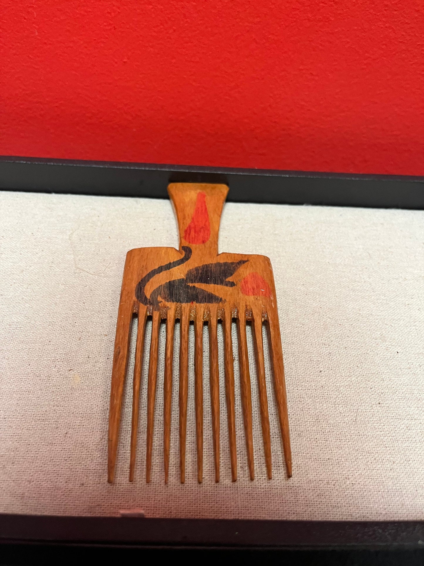 A 7 inch antique hand painted oceanic hair comb Two available