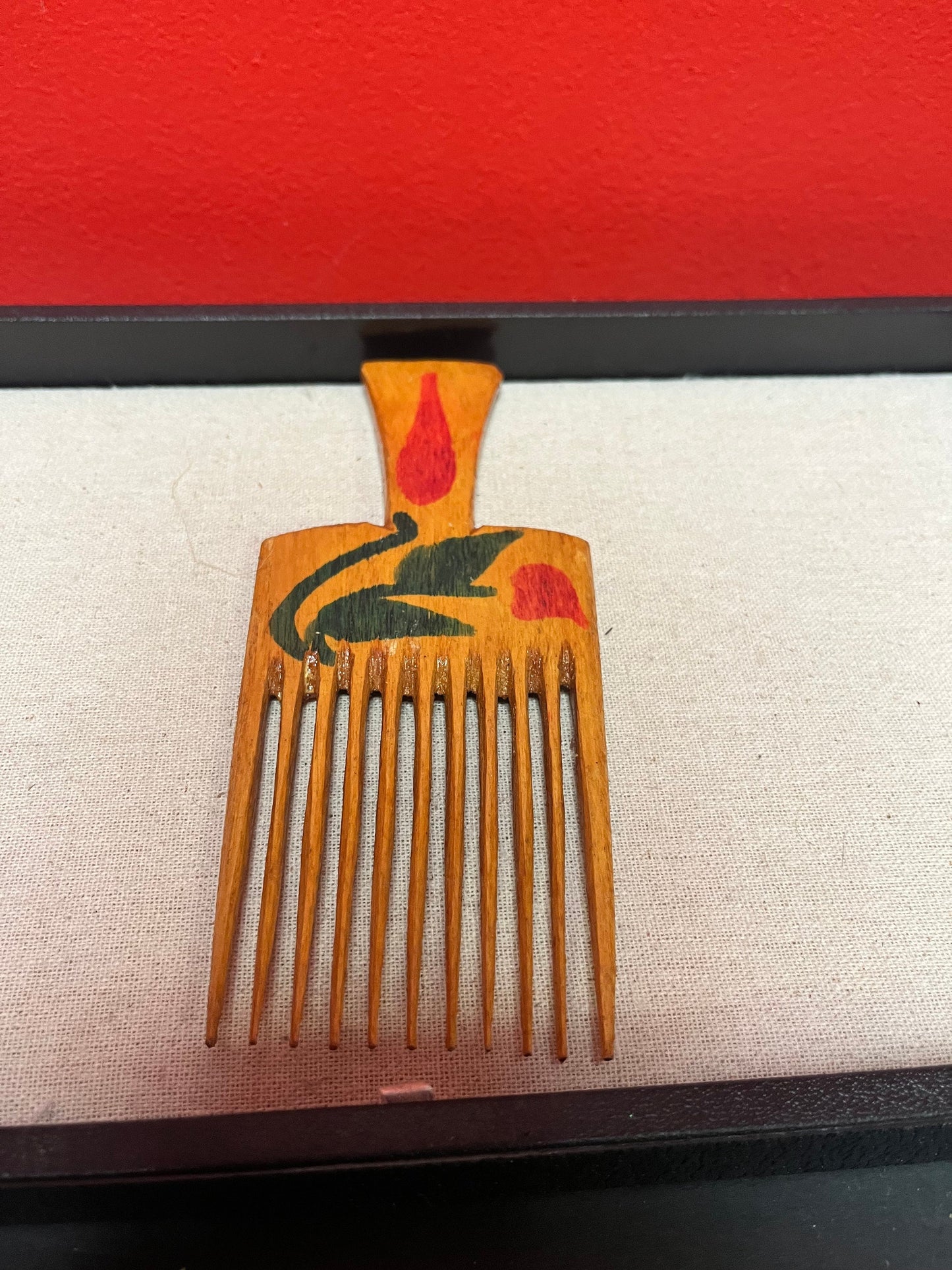 A 7 inch antique hand painted oceanic hair comb Two available