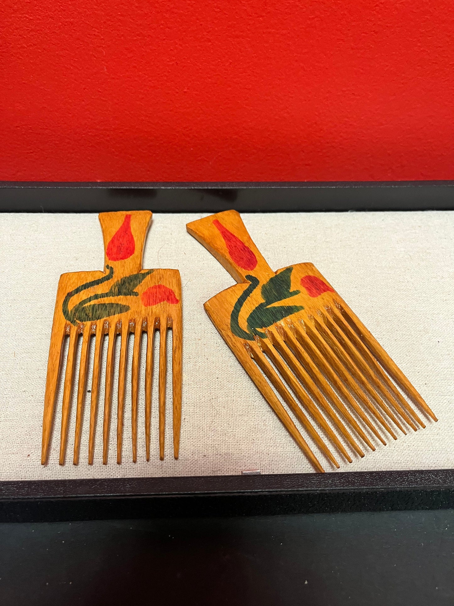 A 7 inch antique hand painted oceanic hair comb Two available
