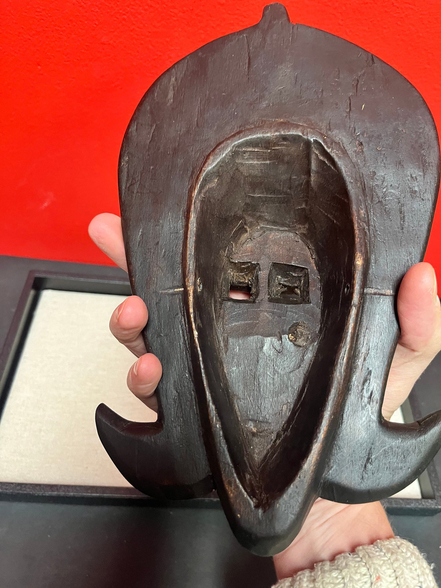 A 10 inch African mask with metal and puka shells very decorative and old