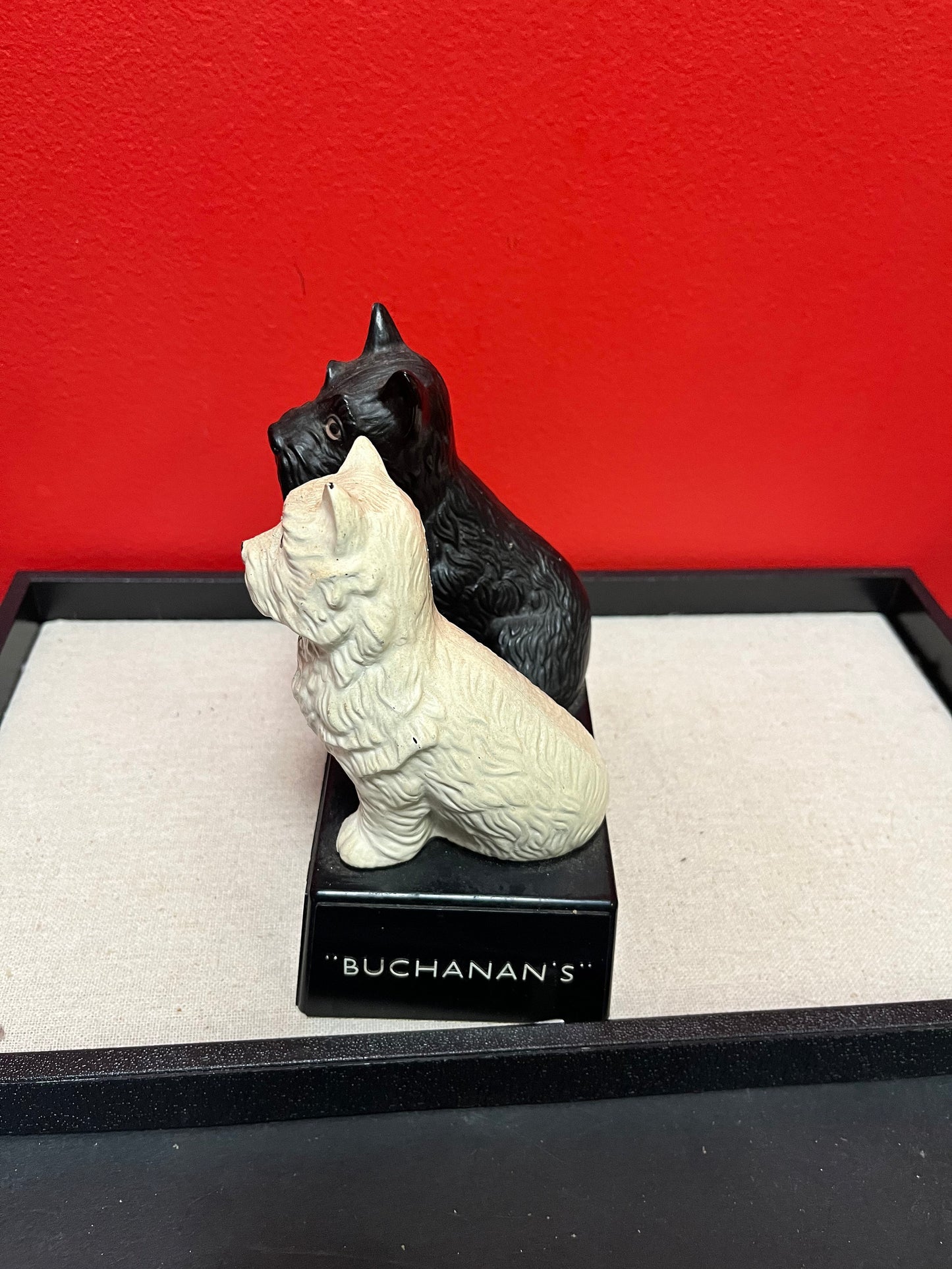 A Lovely 6 inch tall, black and white Buchanan scotch whiskey Scotty dog plastic store advertising figure