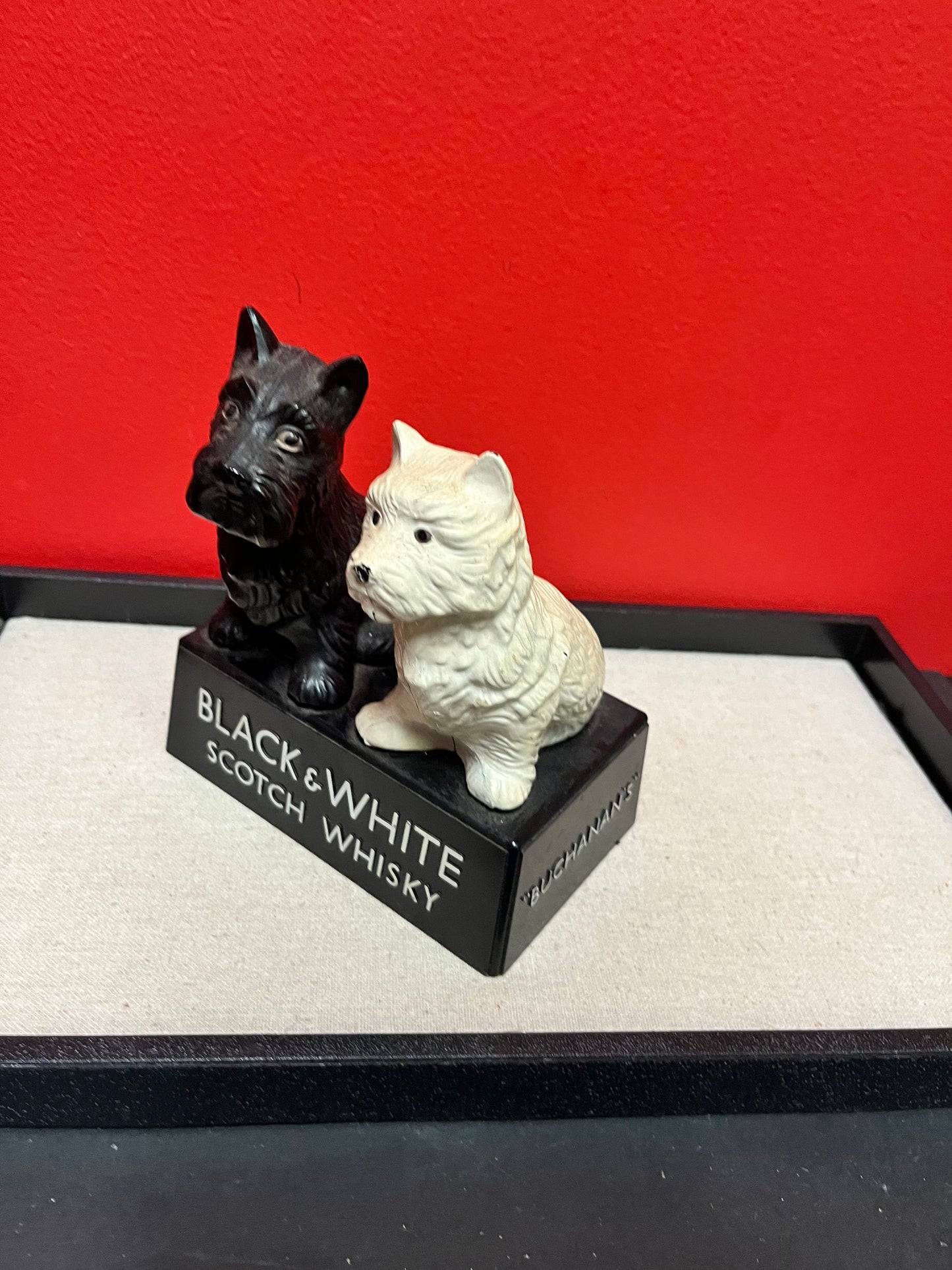 A Lovely 6 inch tall, black and white Buchanan scotch whiskey Scotty dog plastic store advertising figure