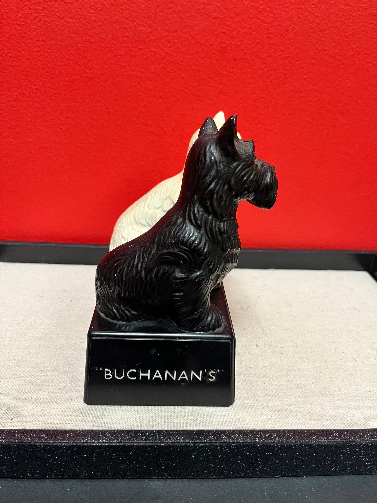 A Lovely 6 inch tall, black and white Buchanan scotch whiskey Scotty dog plastic store advertising figure