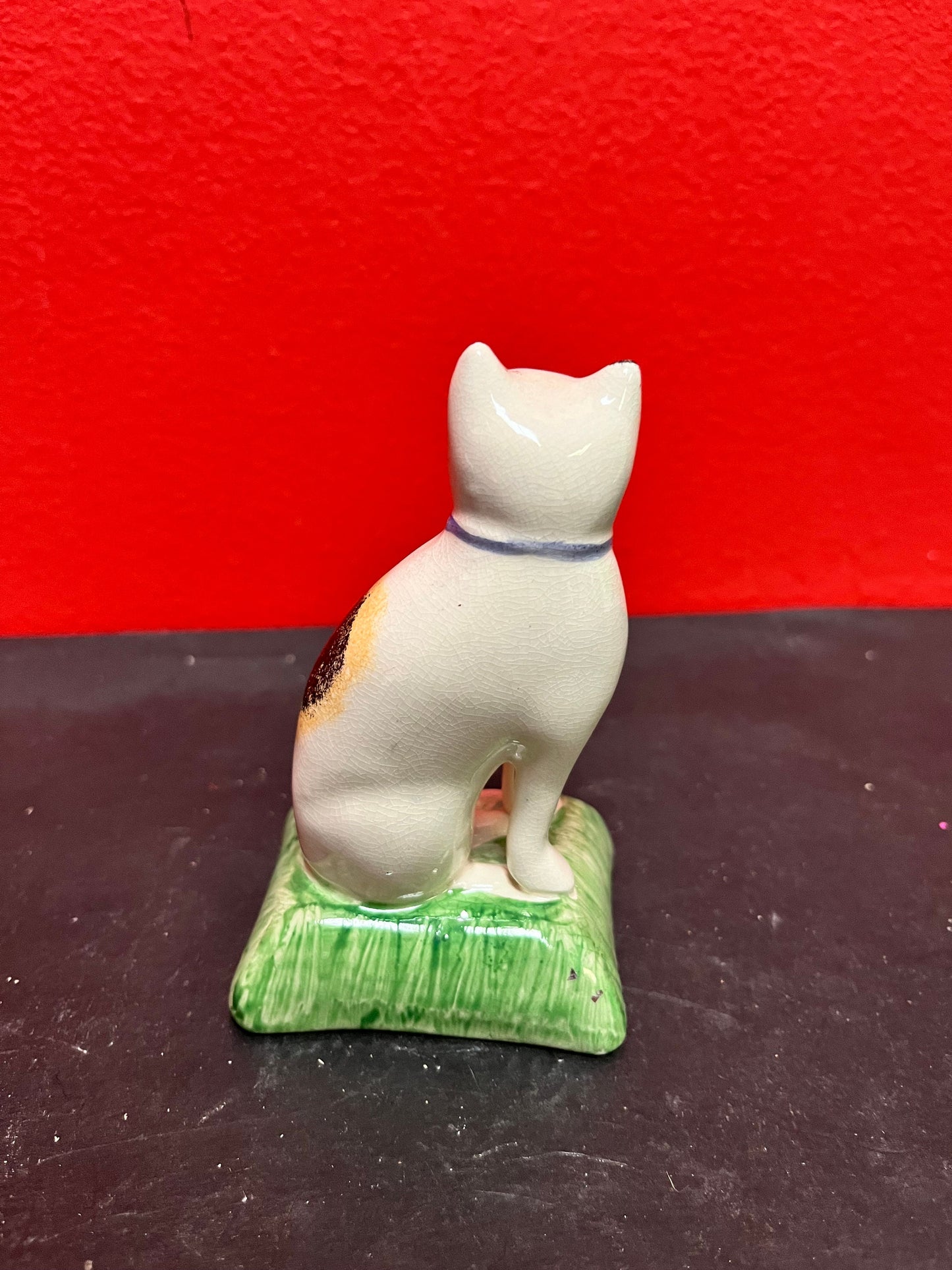 Lovely antique 4 inch high English Staffordshire cat on pillow