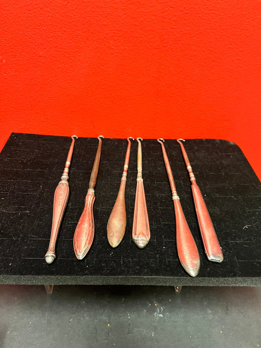 Fantastic job lot of six English sterling handled antique button hooks  7 to 9 inches long each  price for all  wow