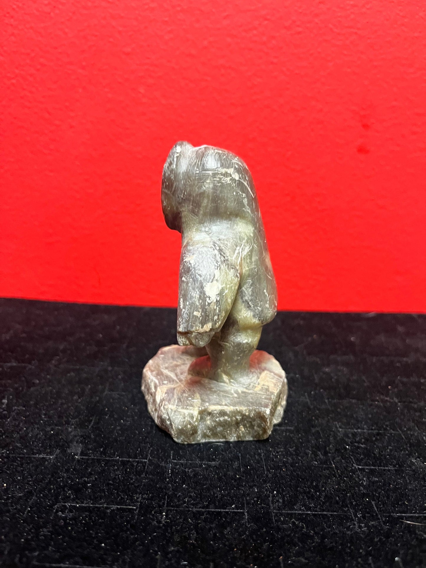 A lovely, 4.5 inch tall, antique indigenous Inuit soapstone statue of a hunter  some minor scratches - signed beauty