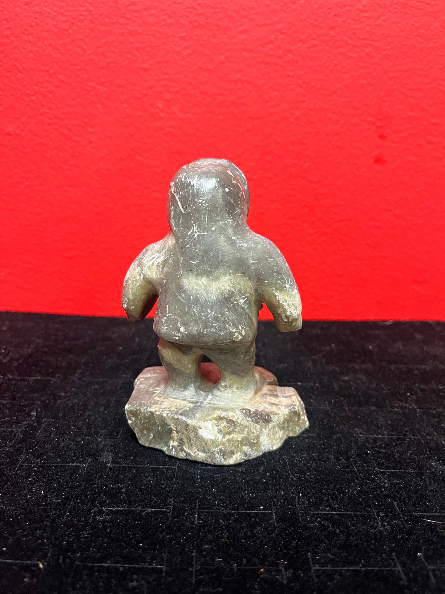 A lovely, 4.5 inch tall, antique indigenous Inuit soapstone statue of a hunter  some minor scratches - signed beauty